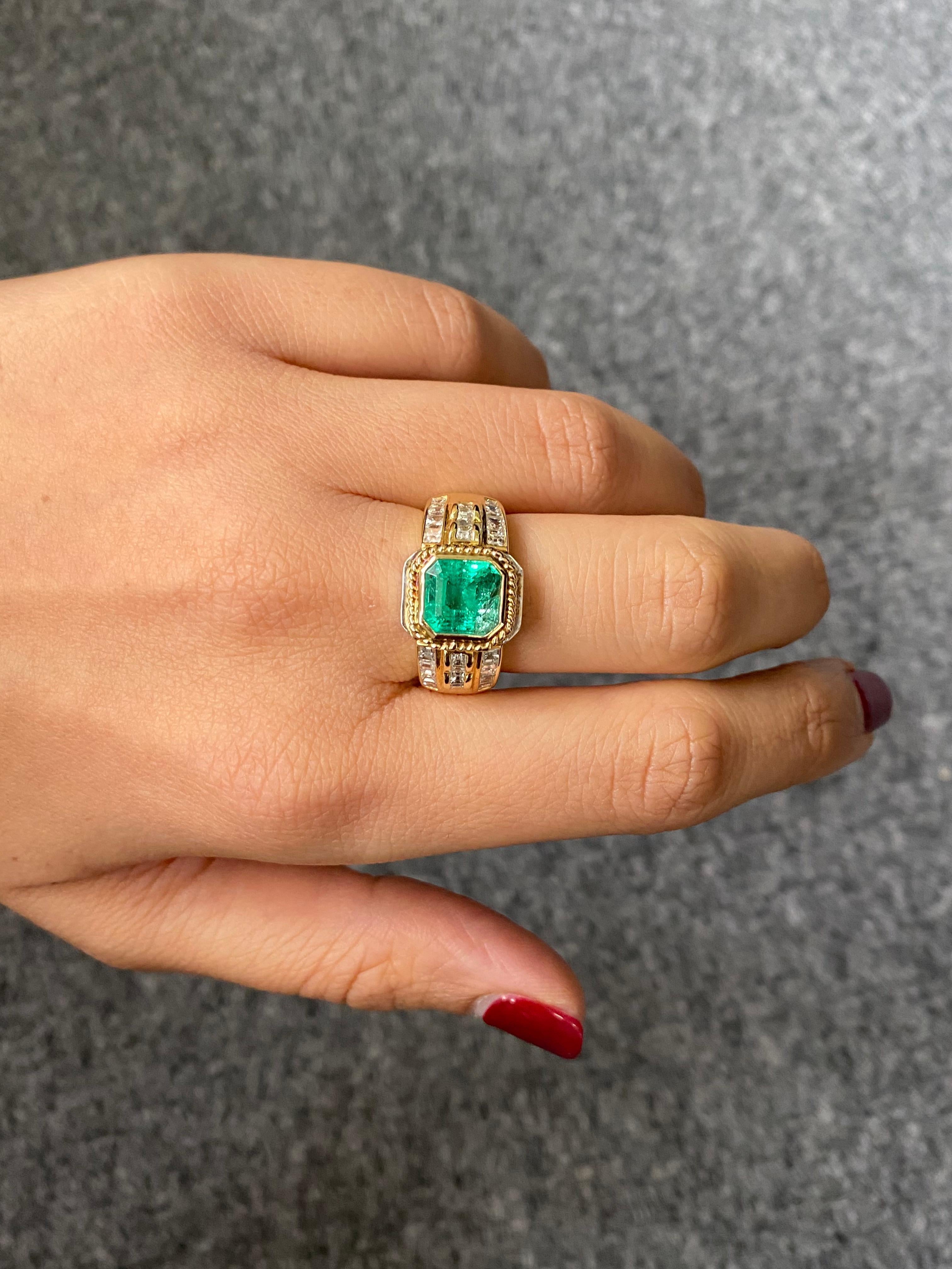 Antique looking, beautiful 2.09 carat Colombian Emerald and 1.70 carat White Diamond band ring. This ring is suitable for both, men and women. The ring is set in solid 18K White and Yellow Gold. The centre stone is absolutely transparent, with