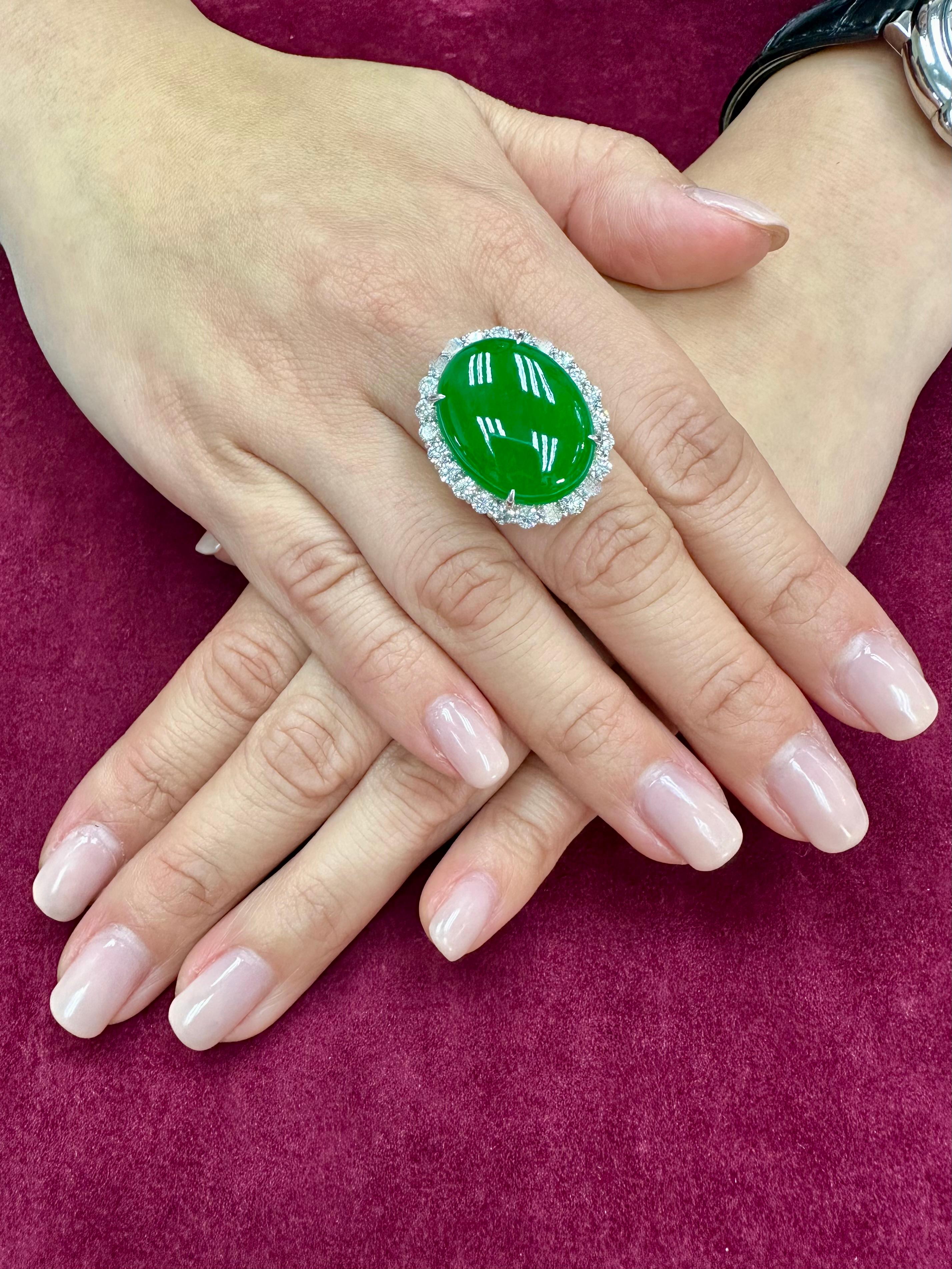 PLEASE CHECK OUT THE HD VIDEO! This jade is intense apple green (borderline imperial green) in color. It is an extra larger 22.7 x 17.6 mm natural jade at 21.28 cts and not backed to show the true color. Diamonds (total 2.27cts) are everywhere in