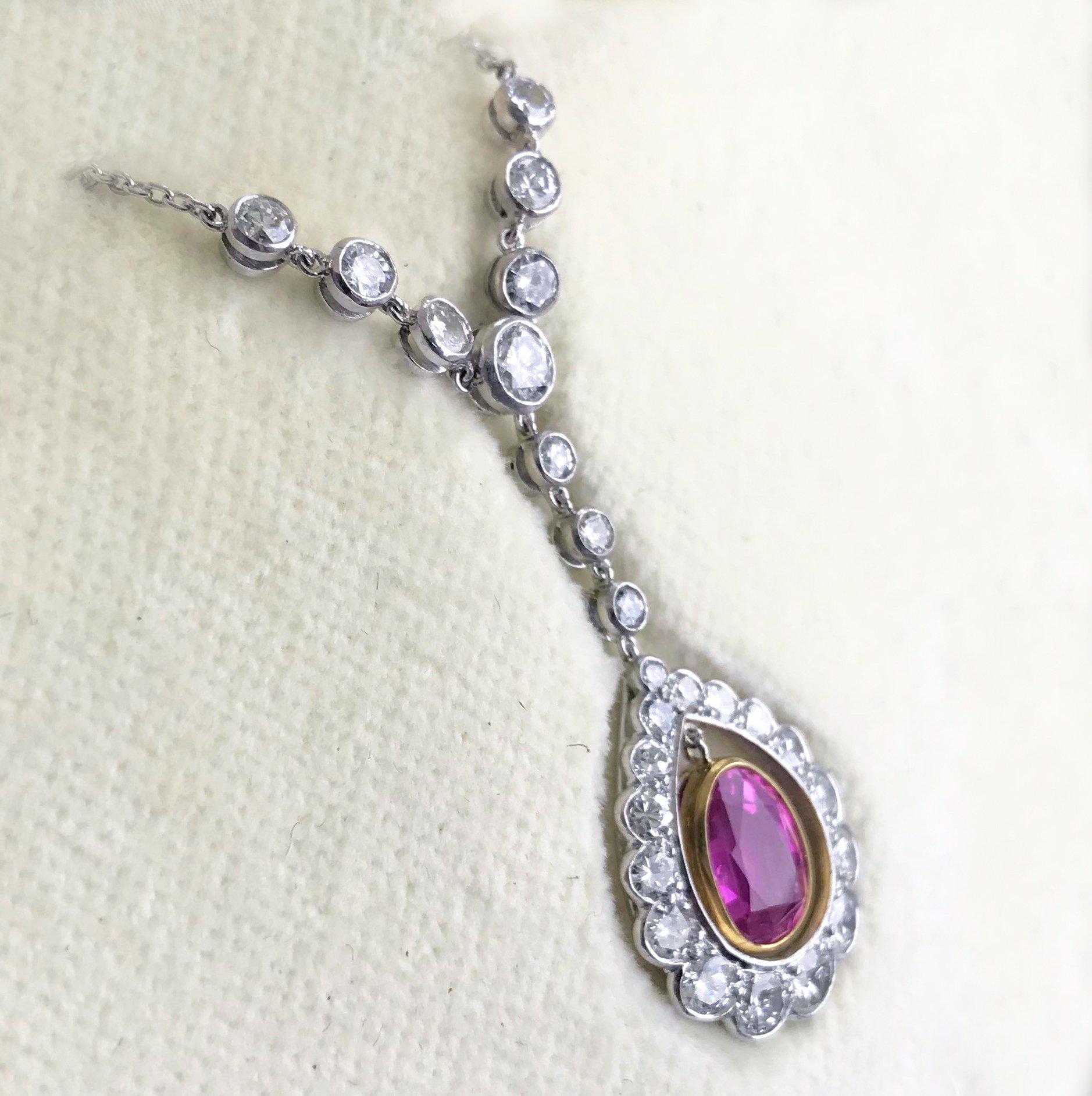 Art Deco, Natural Untreated, Burma, Pink Sapphire and Diamond pendant on a platinum chain, circa 1930.

Articulated, tremblant, central pear shape Pink Sapphire drop, 2.27 carats, (Certificated, natural, Burma and unheated) mounted in 18ct yellow