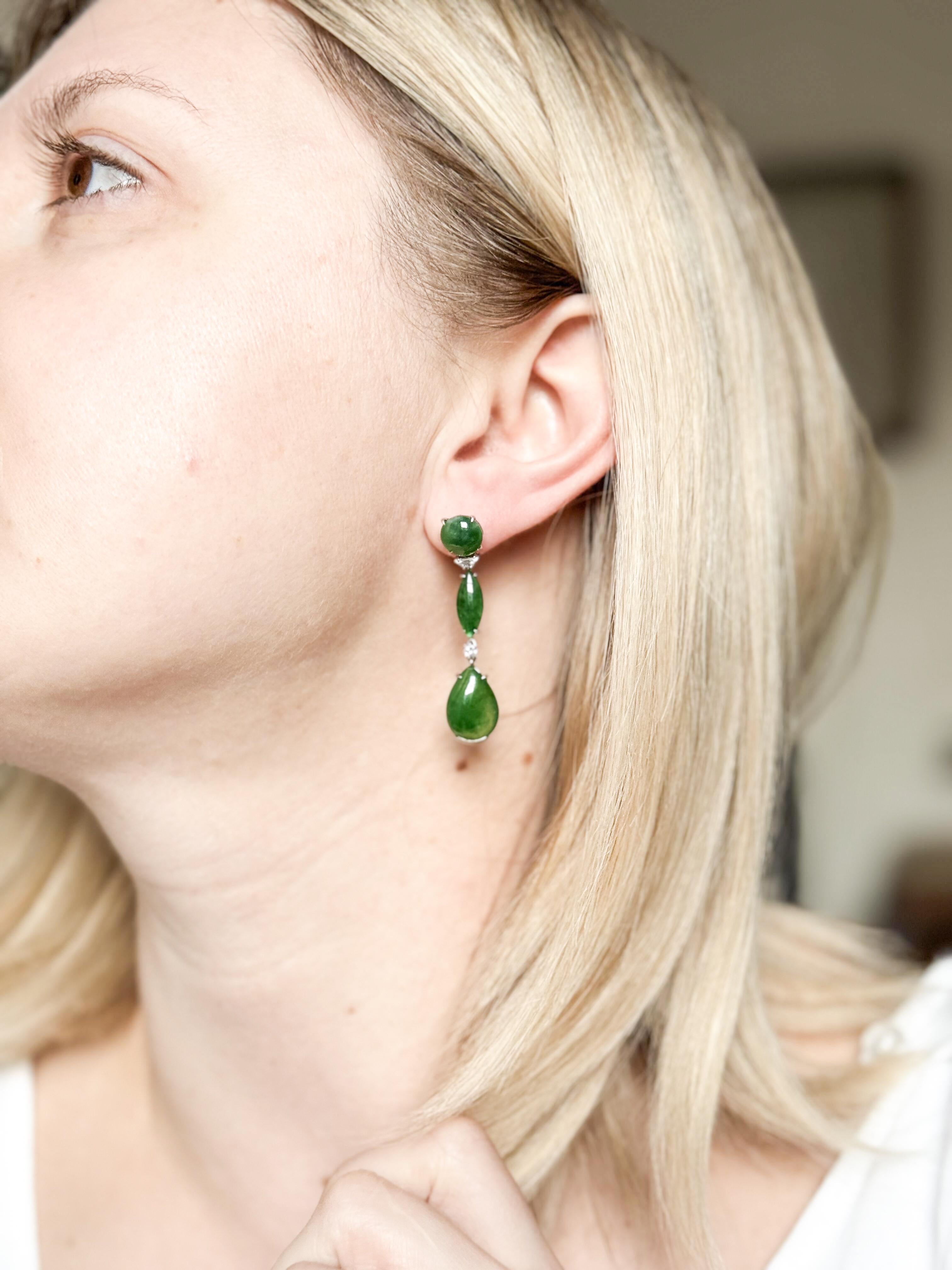 Pair of vintage, circa 1970s 18k gold drop earrings, set with approx. 0.30ctw H/VS diamonds and EGL certified 22.80ctw natural jadeite jade cabochons. Earrings measure 48mm long. Come with an EGL certificate. Weight of the pair - 10.3 grams. 