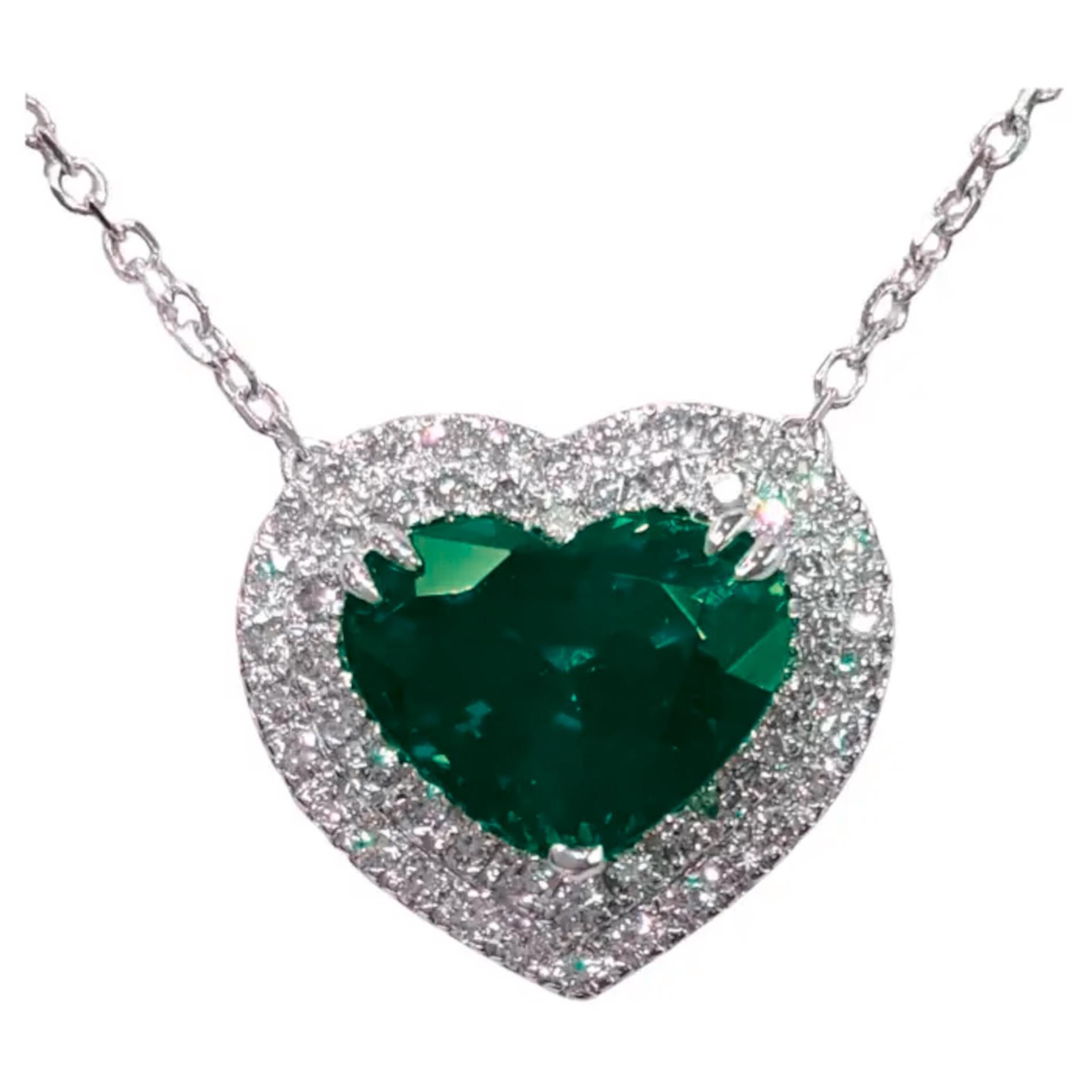 Dazzling Heart-Shaped Emerald and Diamond Halo Pendant in 18K White Gold

This exquisite pendant features a striking heart-shaped emerald, certified by the American Gemological Laboratories, which weighs 2.29 carats and showcases a rich, vibrant