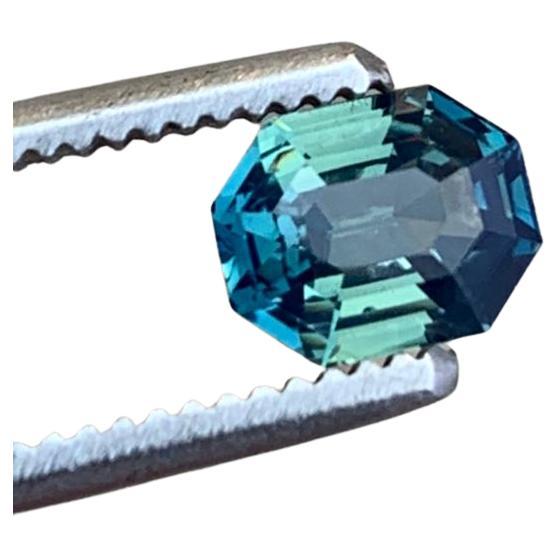 What an extraordinary gemstone, an emerald-cut teal blue sapphire of unparalleled elegance. With its greenish blue hue, this gemstone captivates the eye with its subtle sophistication. 

Boasting a substantial carat weight of 2.22ct and dimensions