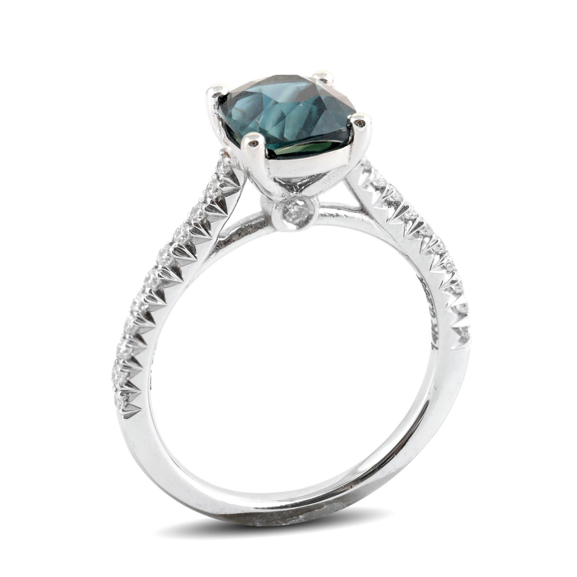 Crafted to perfection, this bluish green sapphire has a delicate blend of color making it an elegant choice for an engagement ring. Cut as a cushion, weighing 2.31 carats, the gemstone boasts a deep tone paired with a lustrous internal sparkle that