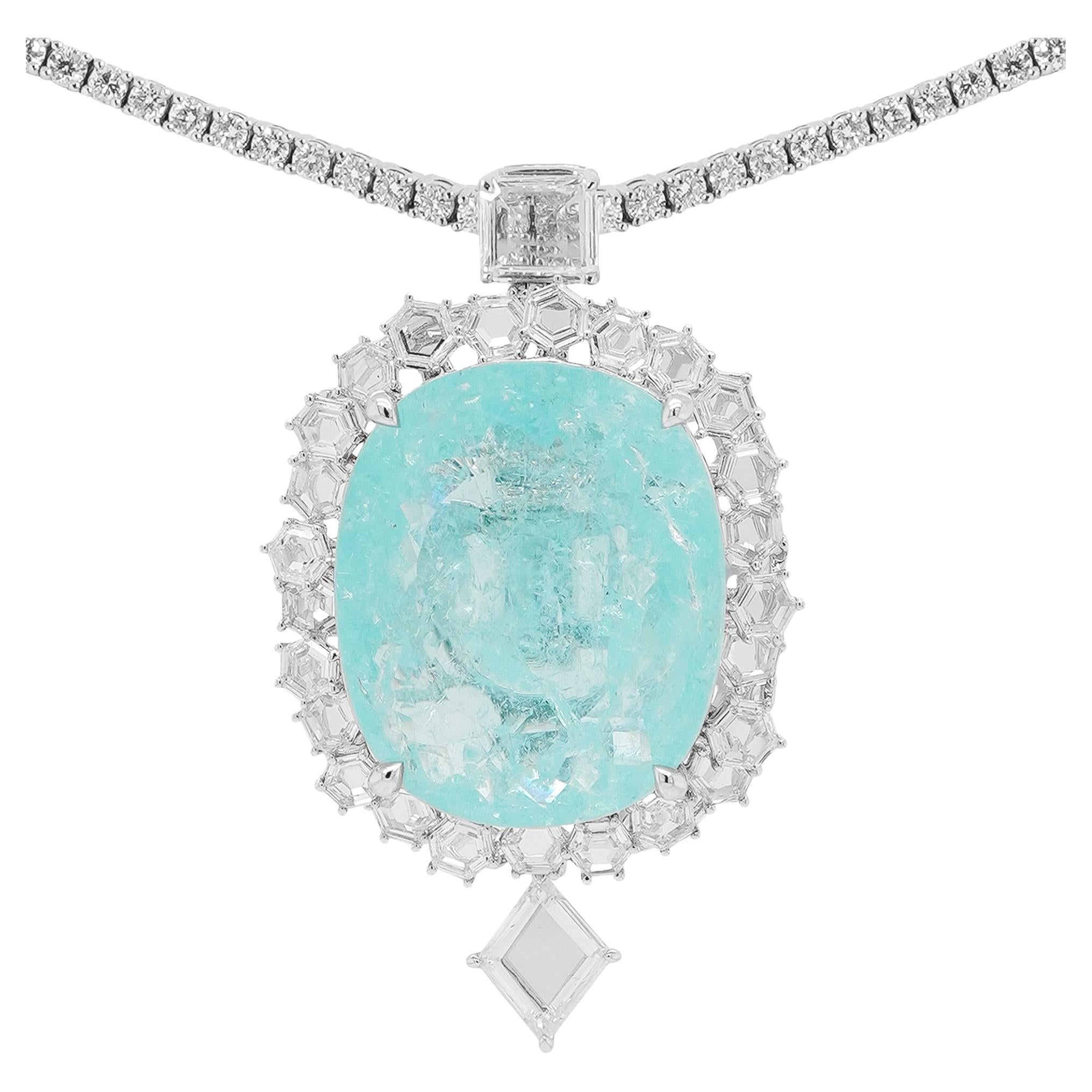 Nous vous présentons non pas un simple bijou, mais une œuvre d'art révolutionnaire : un collier-bague monumental et transformable, centré sur une tourmaline Paraiba du Mozambique certifiée 24 carats, rehaussée d'un époustouflant diamant taille