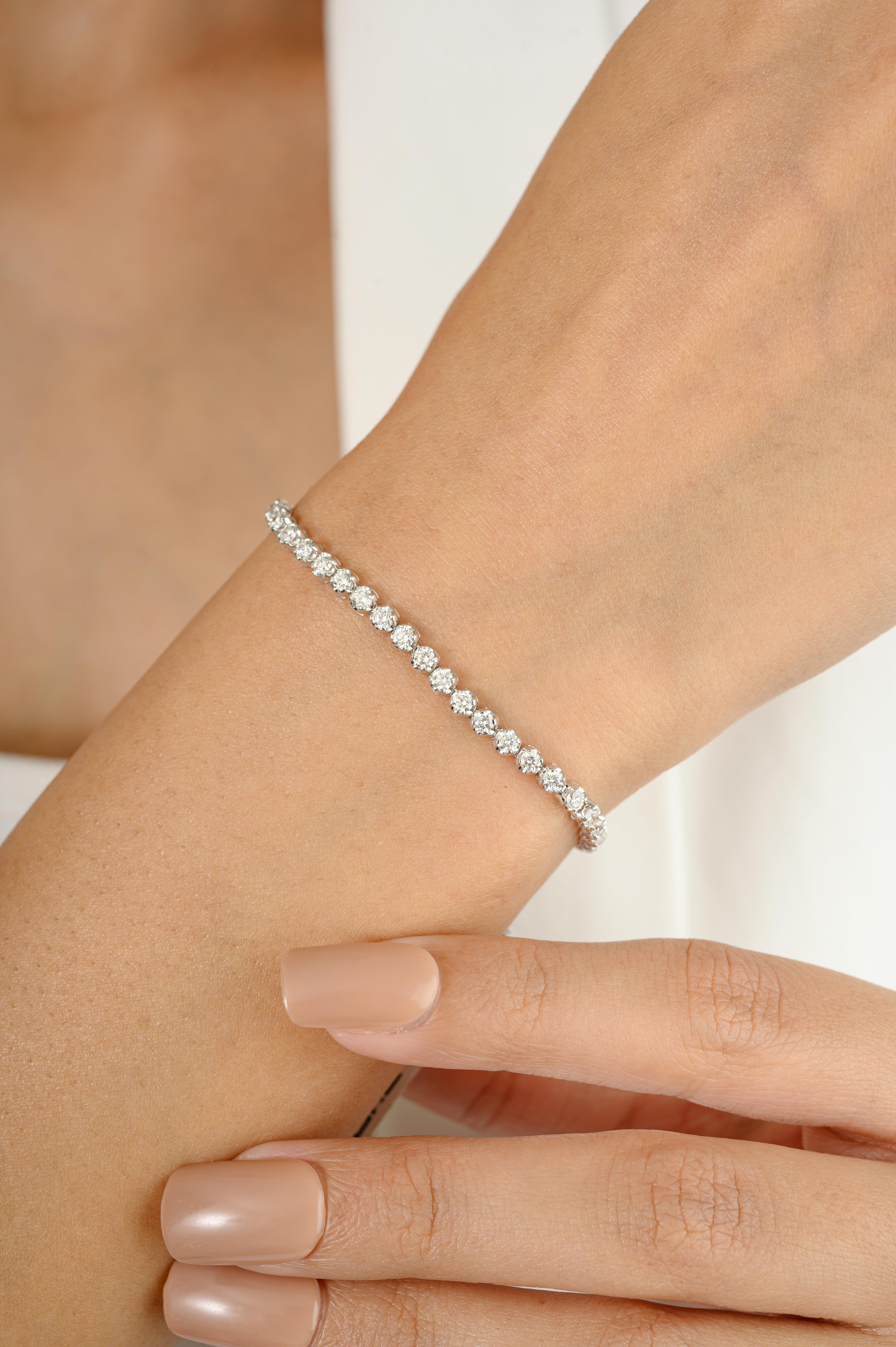 This Certified 2.44 CTW Sleek Diamond Tennis Bracelet for Wedding in 18K gold showcases sparkling natural diamonds, weighing 2.44 carat. 
April birthstone diamond brings love, fame, success and prosperity.
Designed with round cut diamonds set in