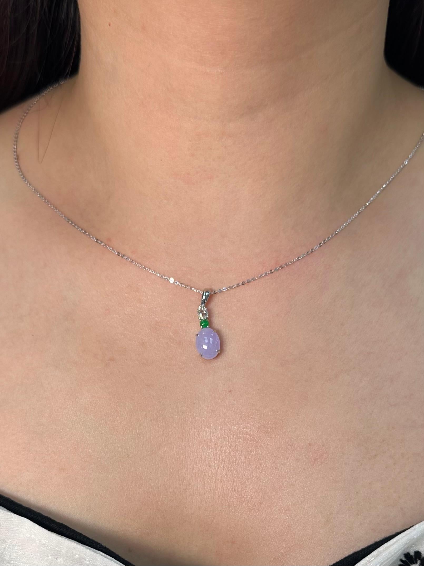 Please check out the HD video! The Jade is certified to be natural. The pendant is set in 18k white gold with one rose cut diamond. The diamond weights 0.18 cts. The untreated / un-enhanced natural lavender jade is translucent. The color is a