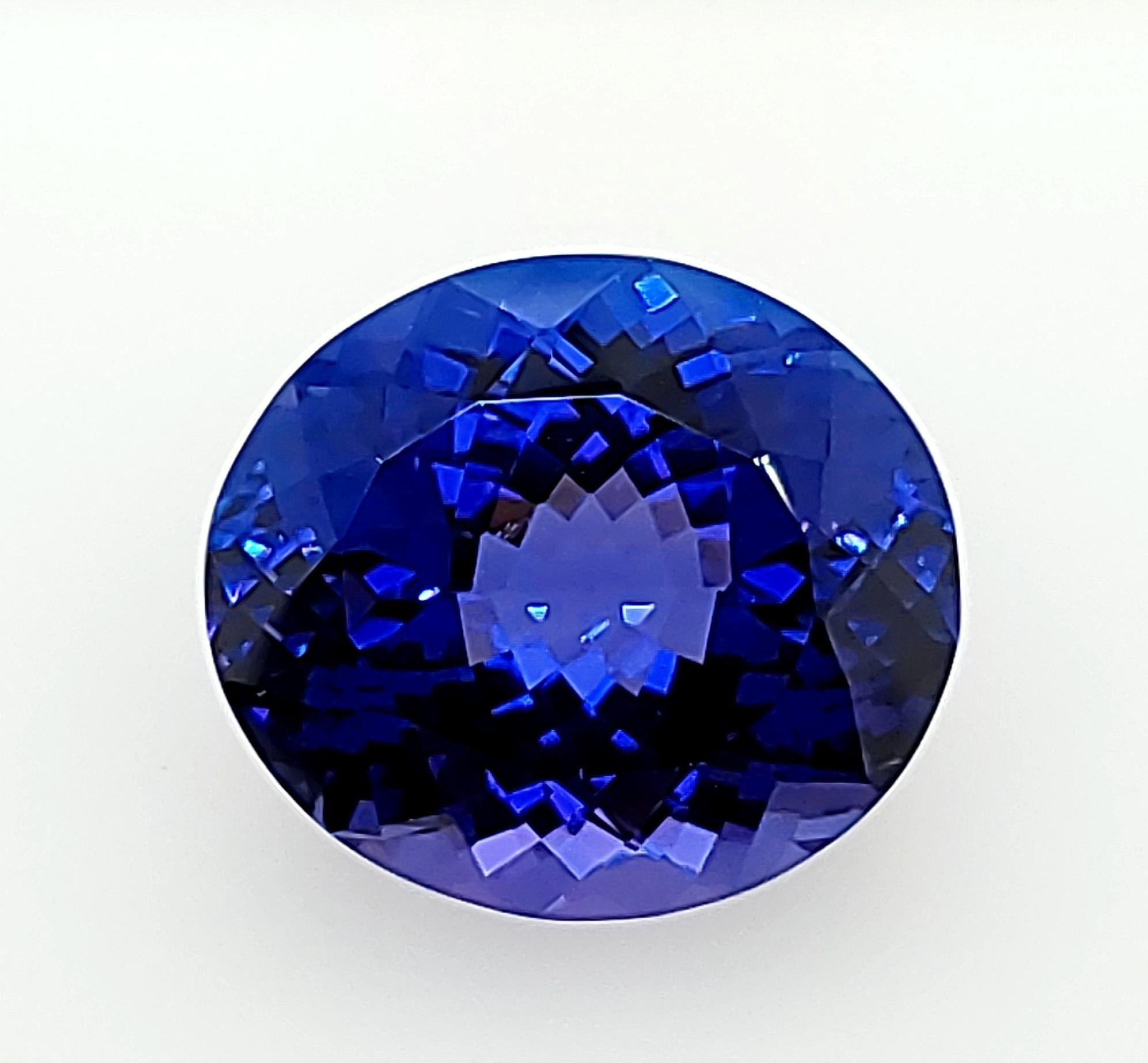 Oval Cut Certified 24.97ct Glowing Blue Tanzanite from the early 1990s! For Sale