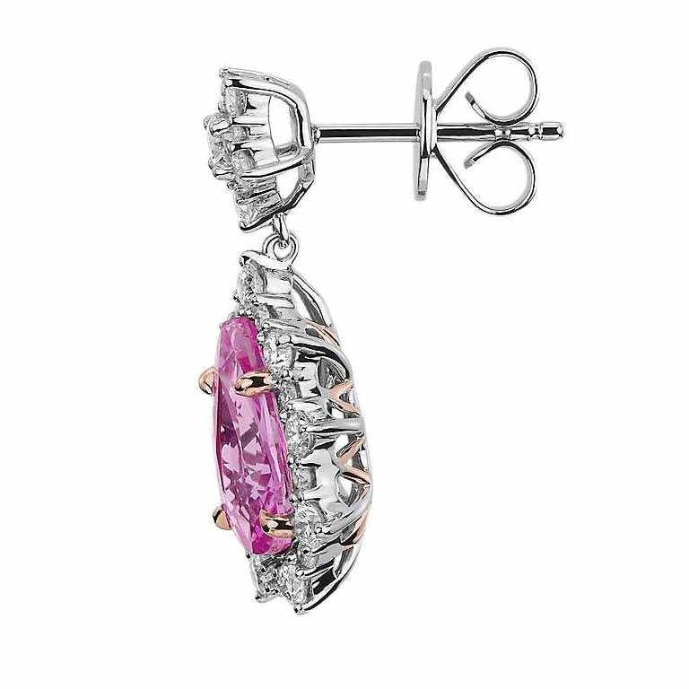 Stunning 2.50 Carat Pink Sapphire and Diamond Pear Drop Earrings in 14K White Gold. Certified by IGI Laboratory in New York, with full diamond jewelry grading report.

1.60 carats of Pear-cut Pink Sapphires pair
with 0.90 carats of Round VS-SI White