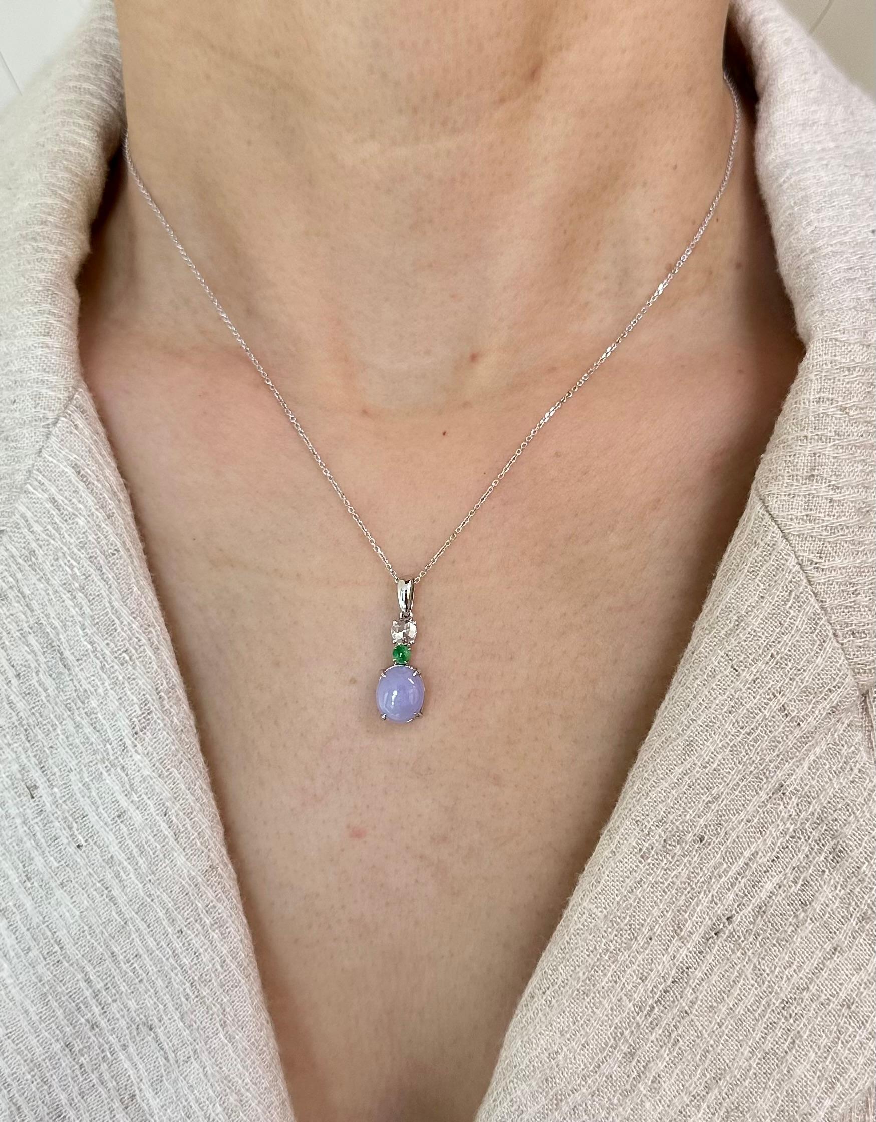 Please check out the HD video! The Jade is certified to be natural. The pendant is set in 18k white gold with one rose cut diamond. The diamond weights 0.17 cts. The untreated / un-enhanced natural lavender jade is translucent. The color is a