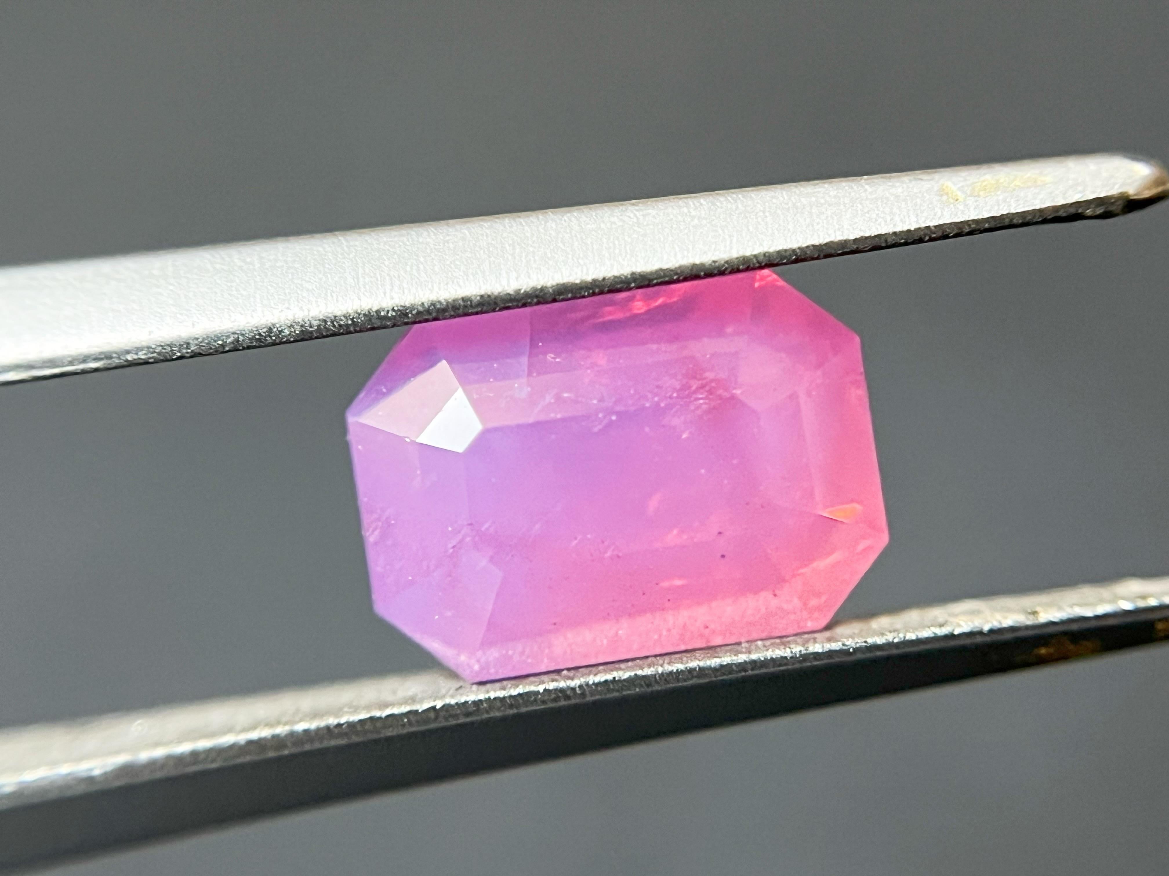 Introducing a rare and exquisite piece of jewelry - the Mahenge spinel, with a milky neon pink color and orange fire that is sure to leave a lasting impression. This gemstone is a true rarity, with a vibrant and intense hue that is seldom seen in