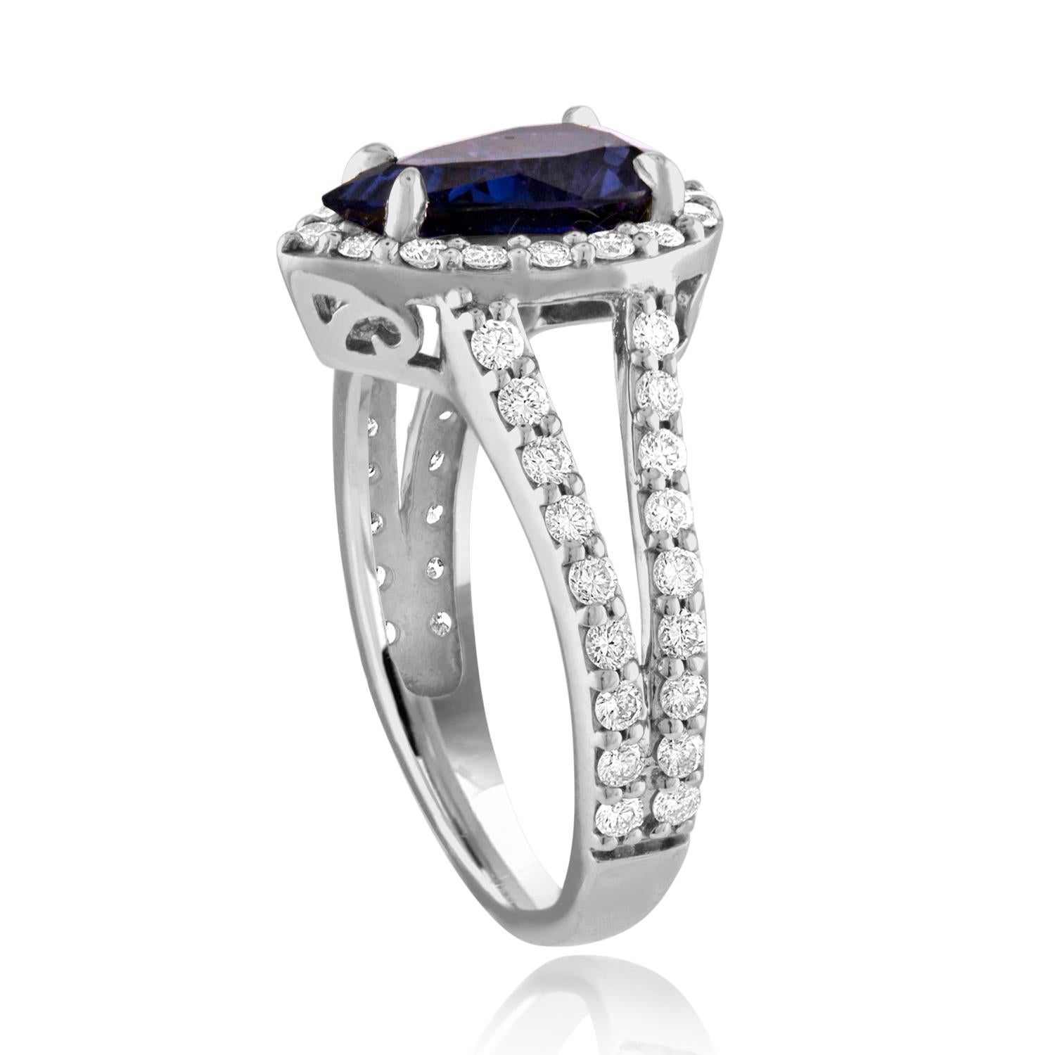 Beautiful Pear Halo Ring
The ring is 14K White Gold
The ring has 0.79 carats F VS in white diamonds.
The center stone is a pear shaped 2.56 Carat Violet Blue Sapphire.
The Sapphire is heated and is certified by LAPIS.
The ring is a size 7.00,