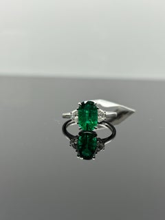 Certified 2.56 Oval Shaped Emerald and Diamond Three Stone Engagement Ring