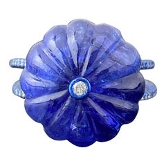Certified 26.05 Carat Carved Tanzanite and Diamond Cocktail Ring In 18K Gold