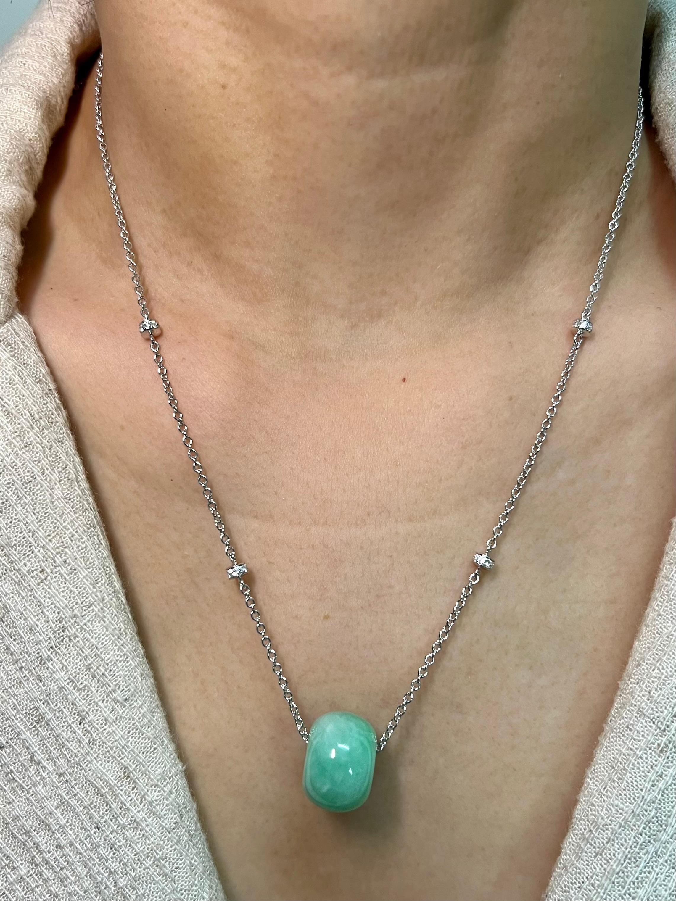 Please check out the HD video! Here is a nice Jade donut pendant with a custom diamond necklace. The jade's outer diameter is almost 16mm. The adjustable 16 and 18 inch necklace is set in 18k white gold and diamonds. There are 32 white diamonds