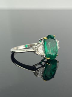Certified 2.68 Carat Oval Cut Emerald and Diamond Three-Stone Engagement Ring