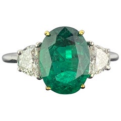 Certified 2.68 Carat Oval Cut Emerald and Diamond Three-Stone Engagement Ring
