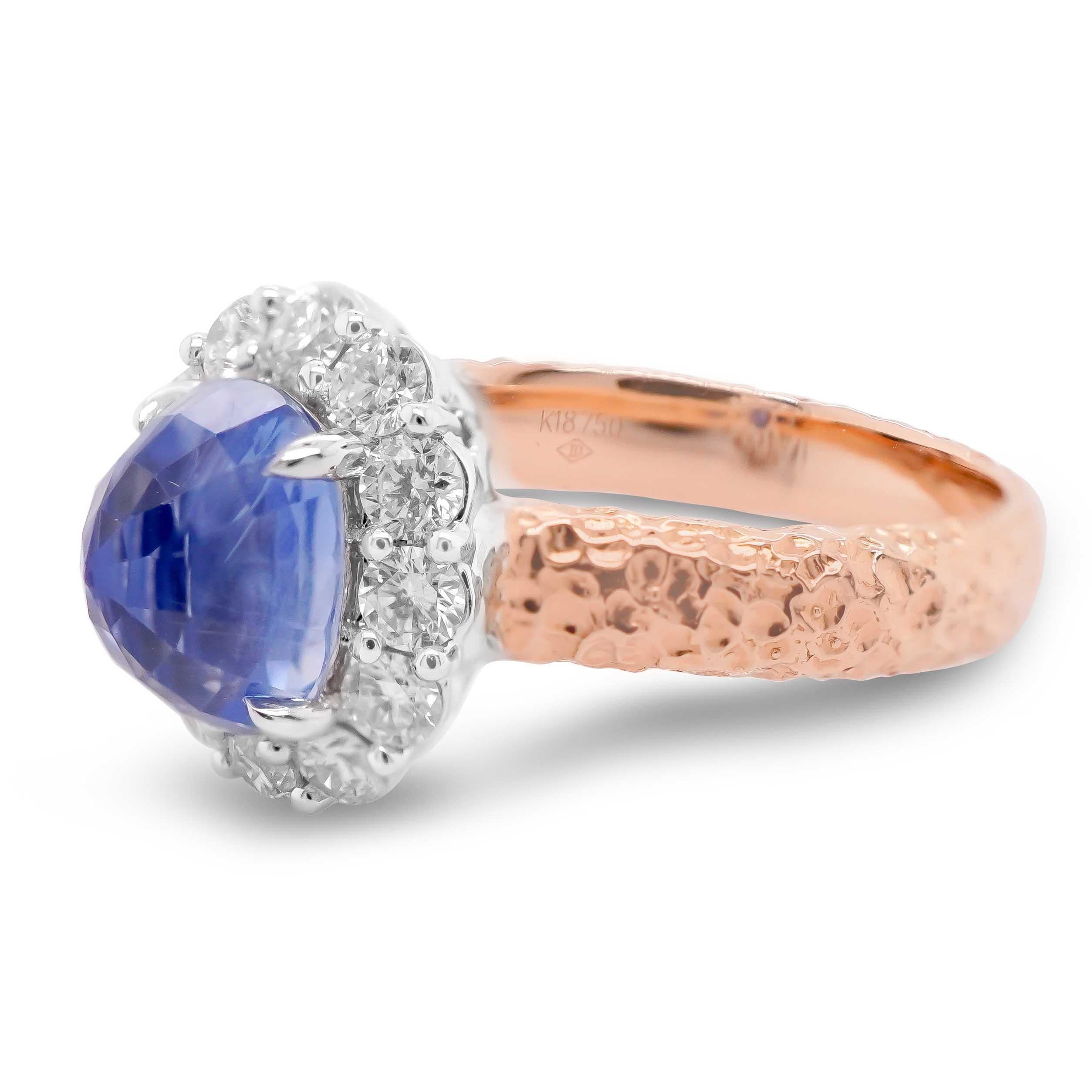 A certified 2.68 carat sapphire is set upside down in a quirky take on inversion in this matt finished rose gold 18K hand made ring.
The ring is also accented by 0.58 carat of white round brilliant diamond. The details of the ring are mentioned