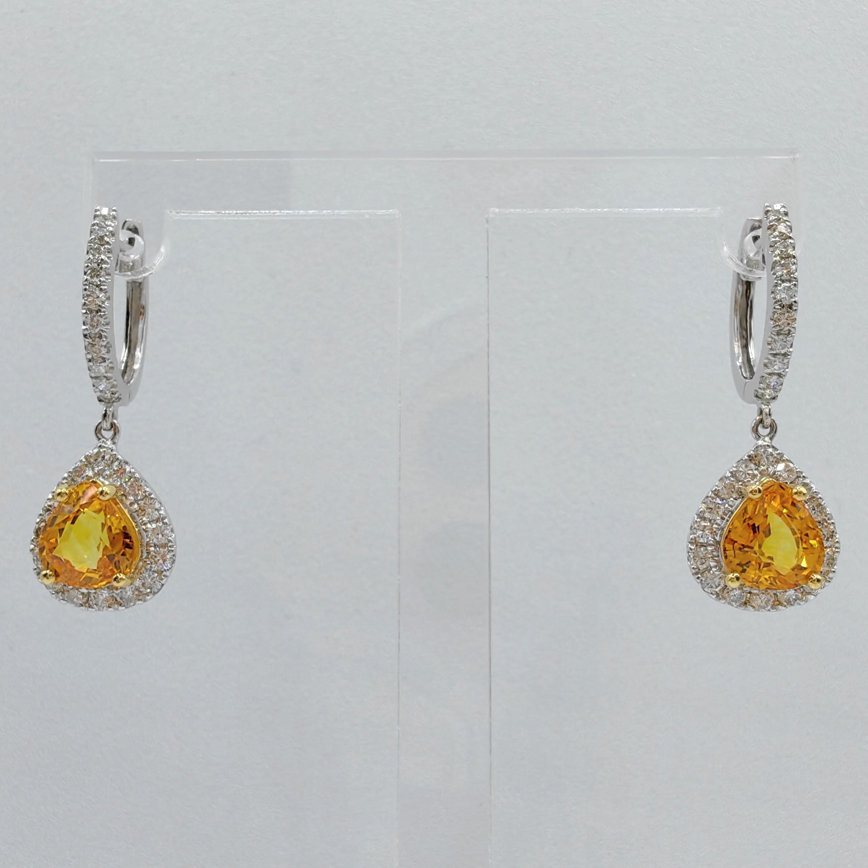 Introducing our 2.64ct Pear Cut Teardrop Yellow Sapphire Diamond Drop Earrings in 18K White Gold, a mesmerizing display of elegance and vibrant beauty.

At the heart of these enchanting earrings are two Pear Cut Yellow Sapphires, totaling an