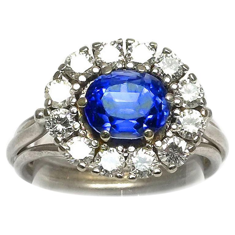 Certified 2.7 Carat Sapphire and Diamond Cluster Ring in Platinum For Sale