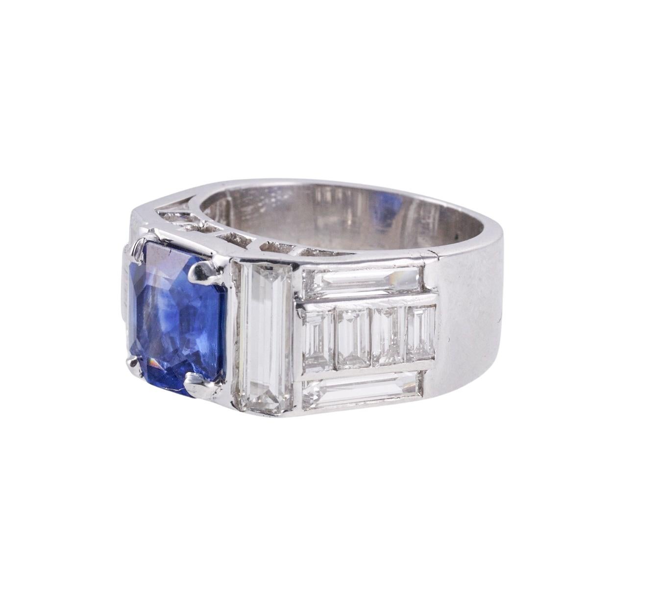 Impressive platinum ring setting, with center AGL certified 2.83ct no heat Kashmir sapphire. Stone measures  8.41 x 7.48 x 4.52mm. Surrounded with approx. 1.00ctw G/VS diamonds. Ring size 5, ring top is 9mm wide. Hallmarked with punchmark on the