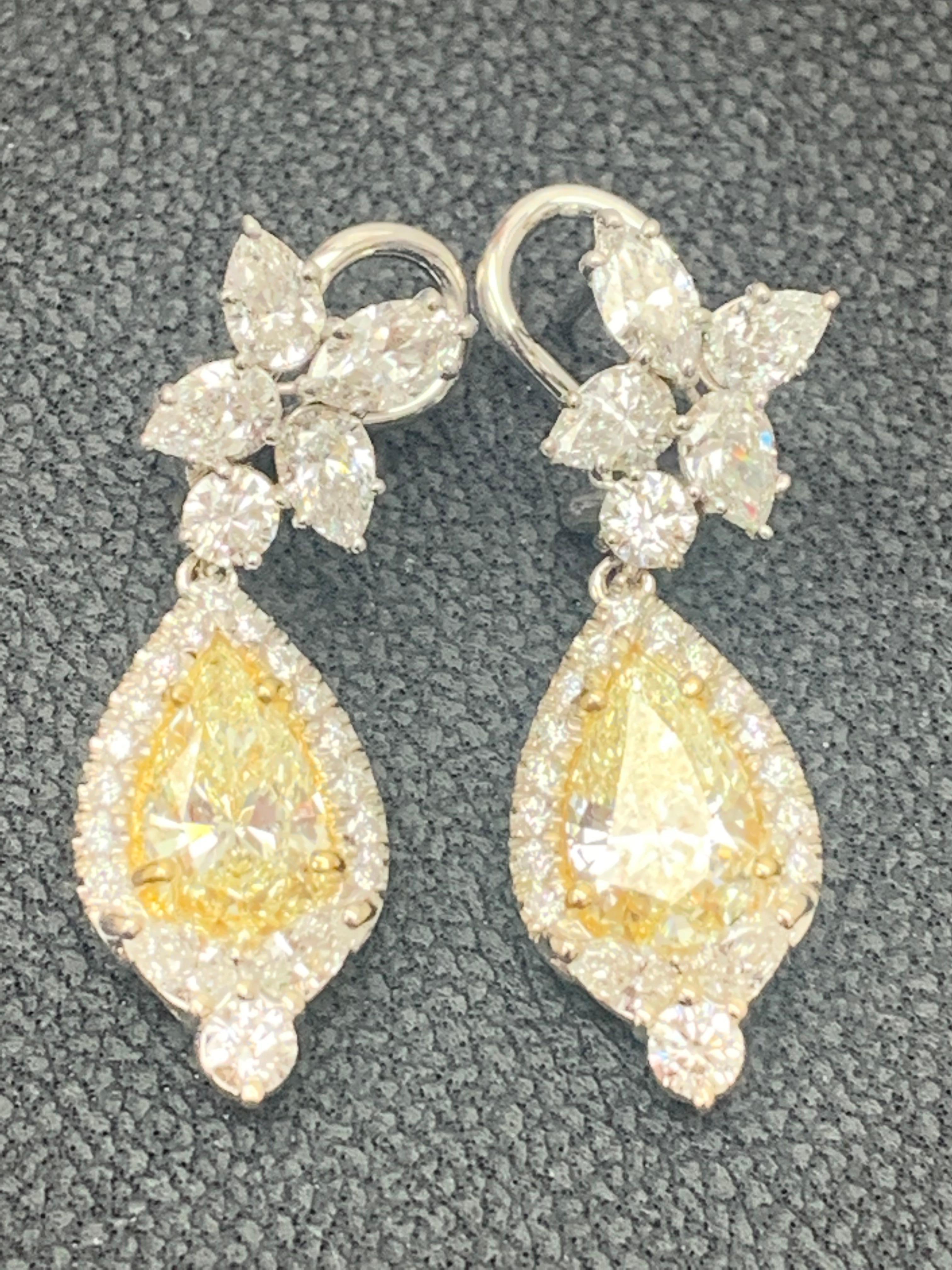 CERTIFIED 2.89 Carat Fancy Yellow Diamond Drop Earrings in 18K White Gold In New Condition For Sale In NEW YORK, NY