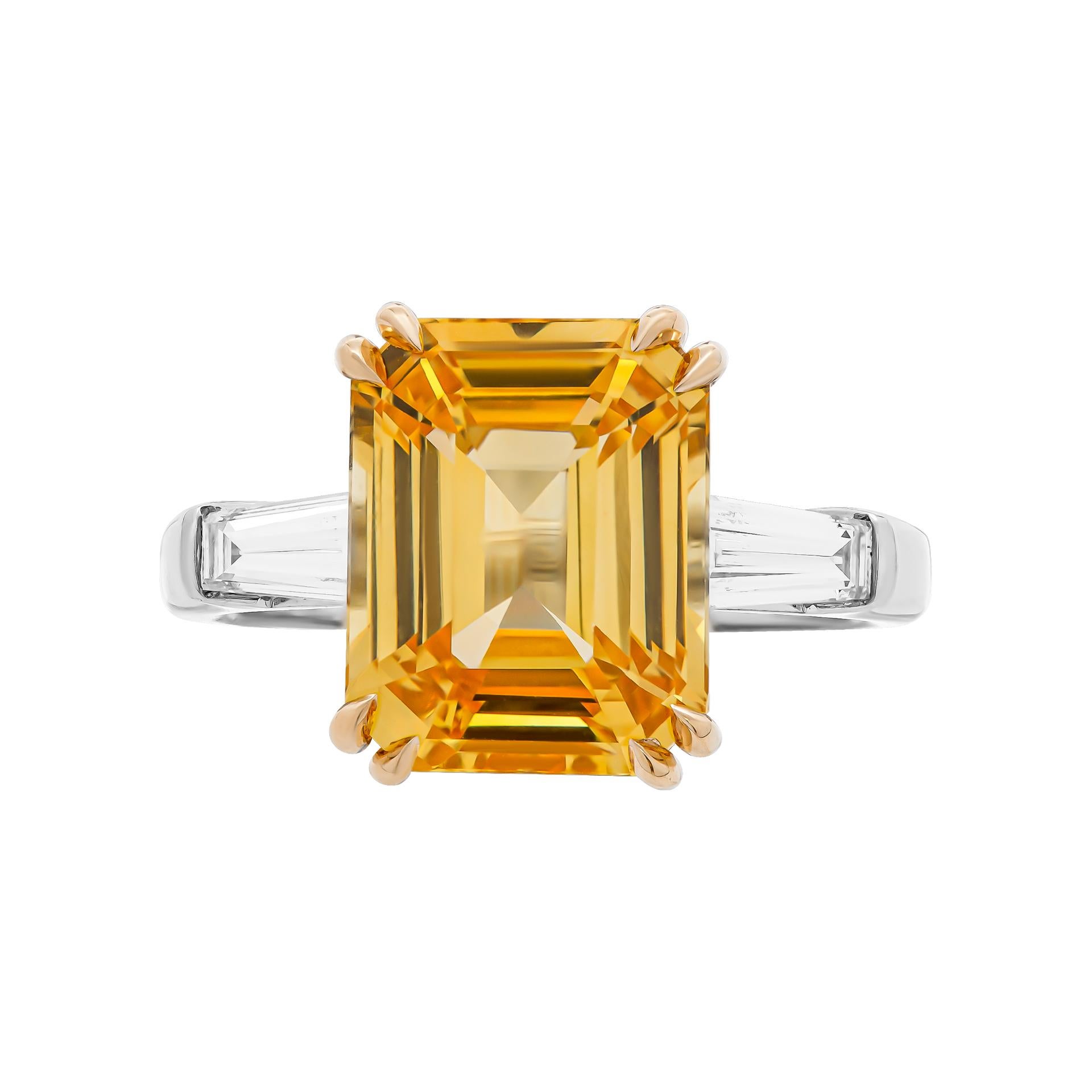 Plain 3 stone Engagement ring in Platinum & 18K Yellow Gold
7.04ct Vivid Yellow Octagonal/Step cut Sapphire 
Certificate: CDC2009878 (heated)
Sri Lanka Sides stones: 0.51ct G VVS tapered baguette
 Size: 6.5
Comes with certificate, appraisal