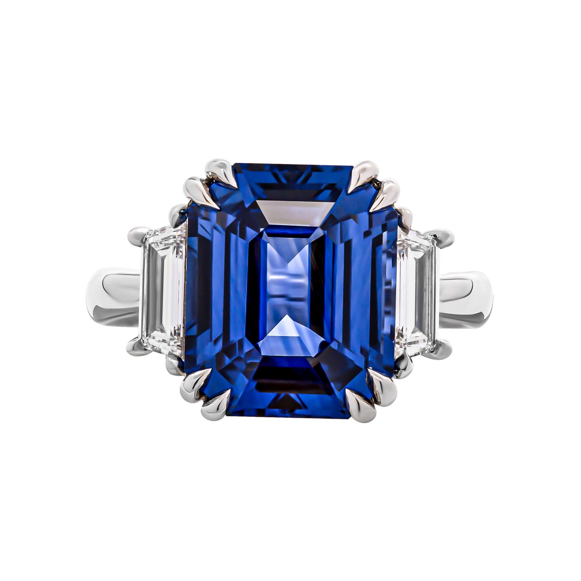 3 stone ring in Platinum
Center stone:  7.97ct Blue Emerald cut Sapphire 
Certified: CDC2201543 
Country of origin: Sri Lanka 
Side stones: 0.66ct F VVS trapezoids
Size: 6.5
