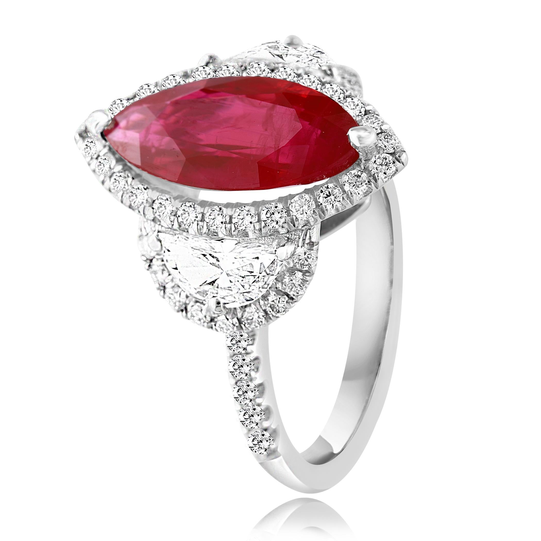 A stunning ring showcasing a rich intense Burmese Red Marquise cut Certified Ruby weighing 3.01 carats surrounded by a row of diamonds. Flanking the center stone are two brilliant cut half-moon diamonds, weighing 0.57 carats total, framed in a