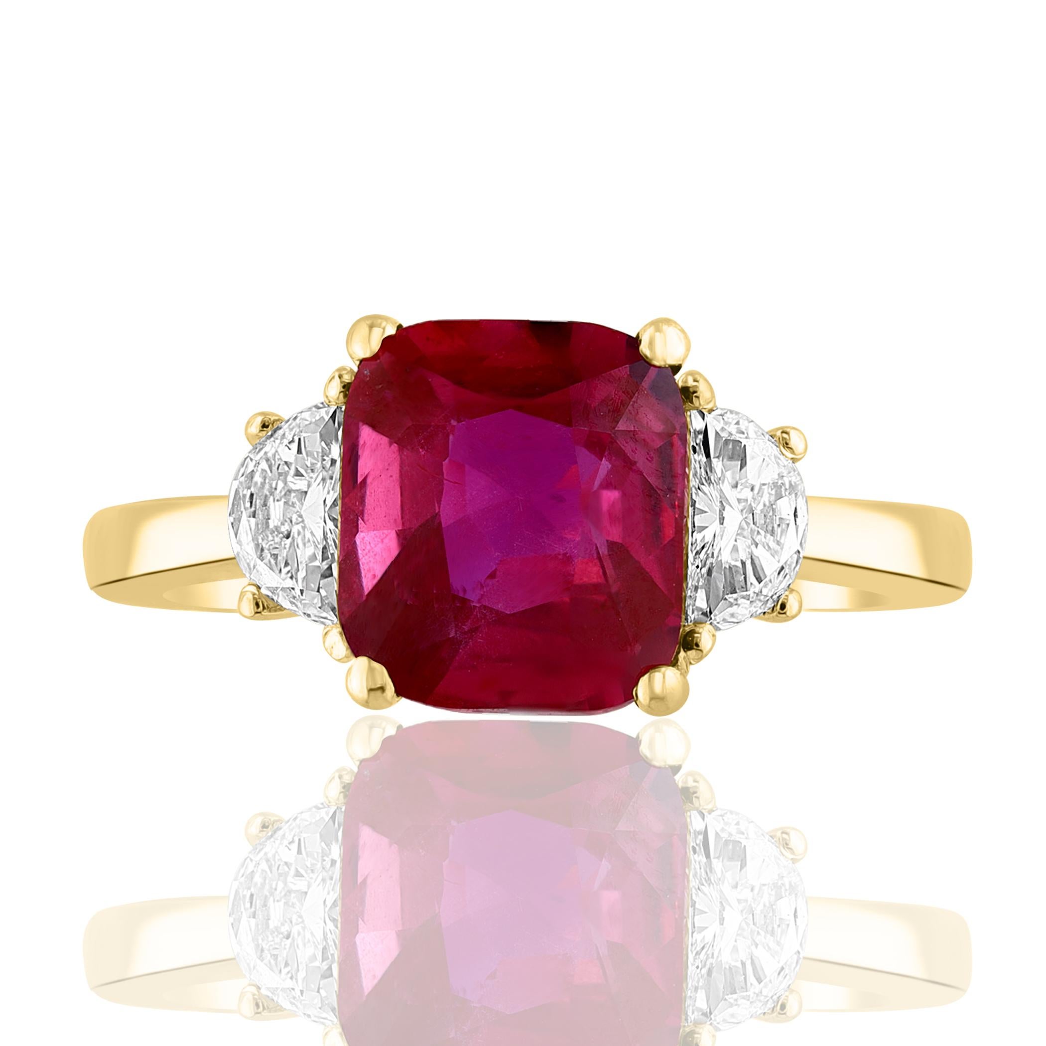 Showcasing Certified Cushion cut, Vibrant color Ruby weighing 3.07 carats, flanked by two brilliant cut half moon diamonds weighing 0.60 carats total. Elegantly set in a polished 18K yellow gold composition.