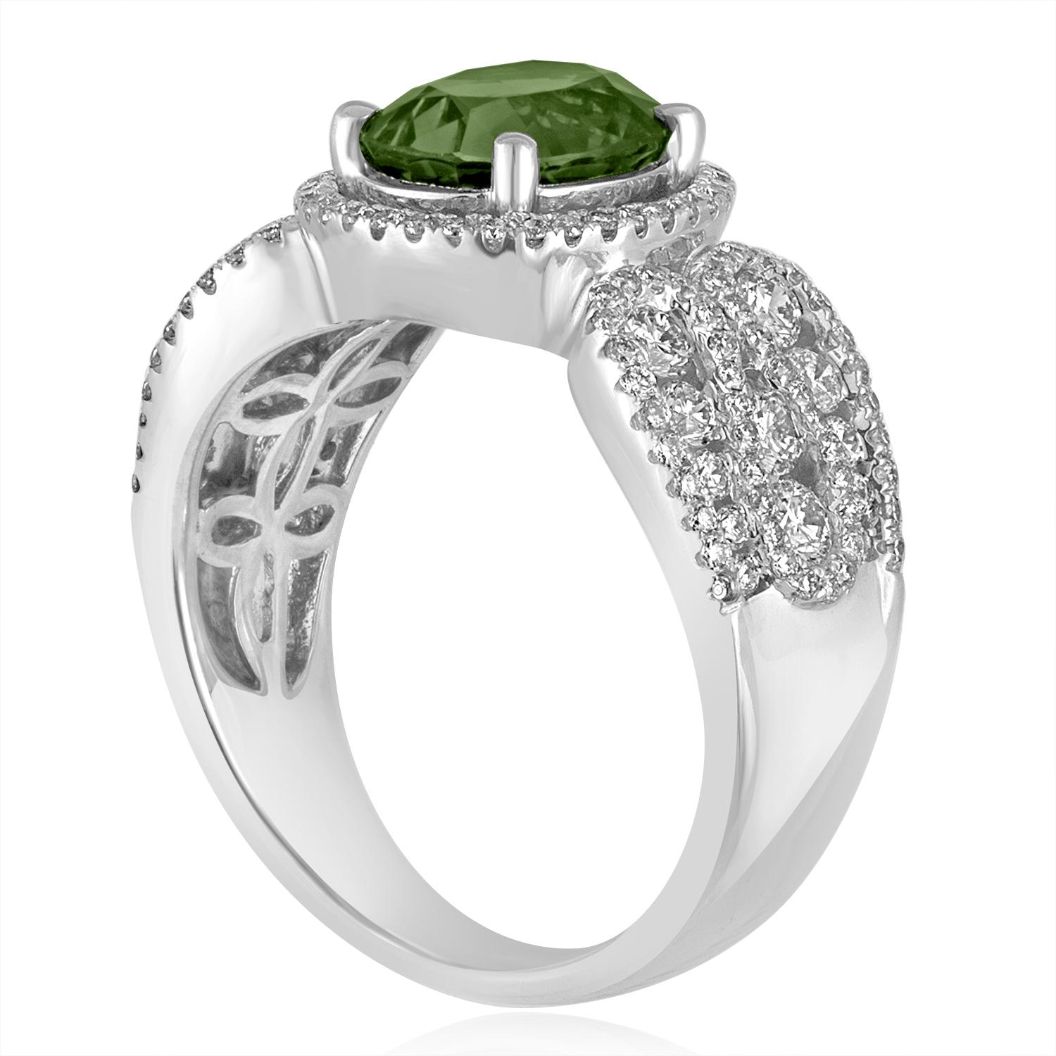 Stunningly Beautiful Green Sapphire Ring
The ring is 18K White Gold
There are 1.04 Carats in White Diamonds F/G VS/SI
The center stone is a Oval Green Sapphire 3.08 Carats
The stone is Certified by LAPIS, HEATED.
The ring is a size 7, sizable.
The