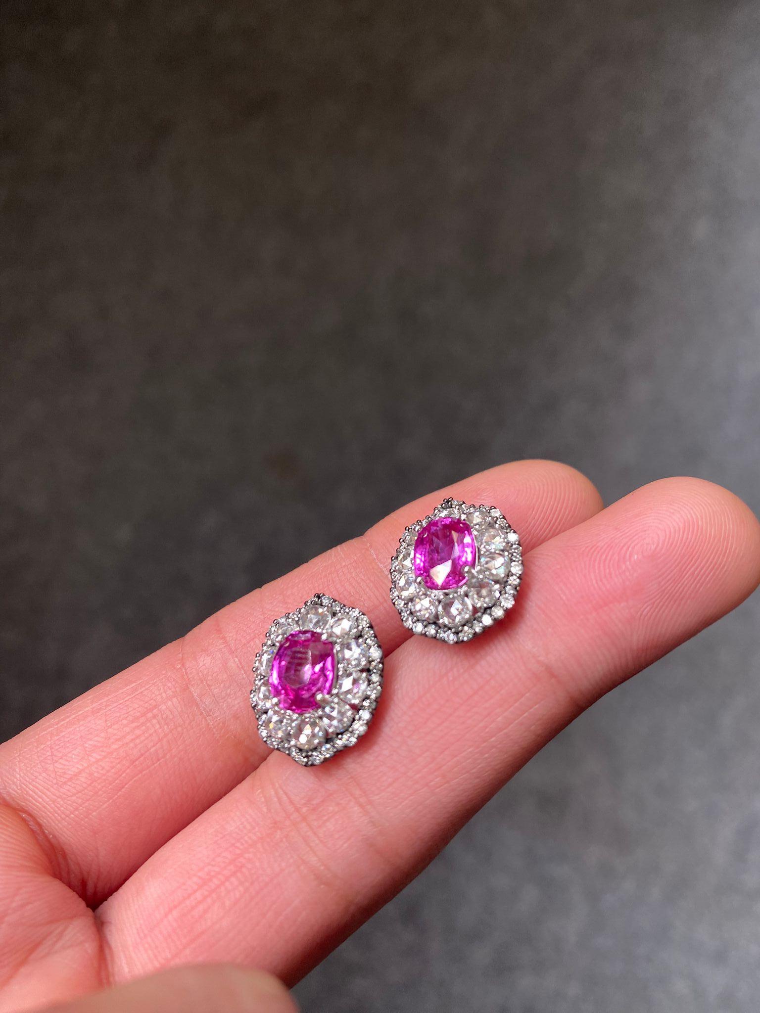 A stunning pair of 3.10 carat Pink Sapphire, originating from Burma - absolutely natural with no treatments, adorned with 1.43 carat rose cut White Diamonds and 0.54 carat round White Diamonds. The design of the earrings are very unique, the black