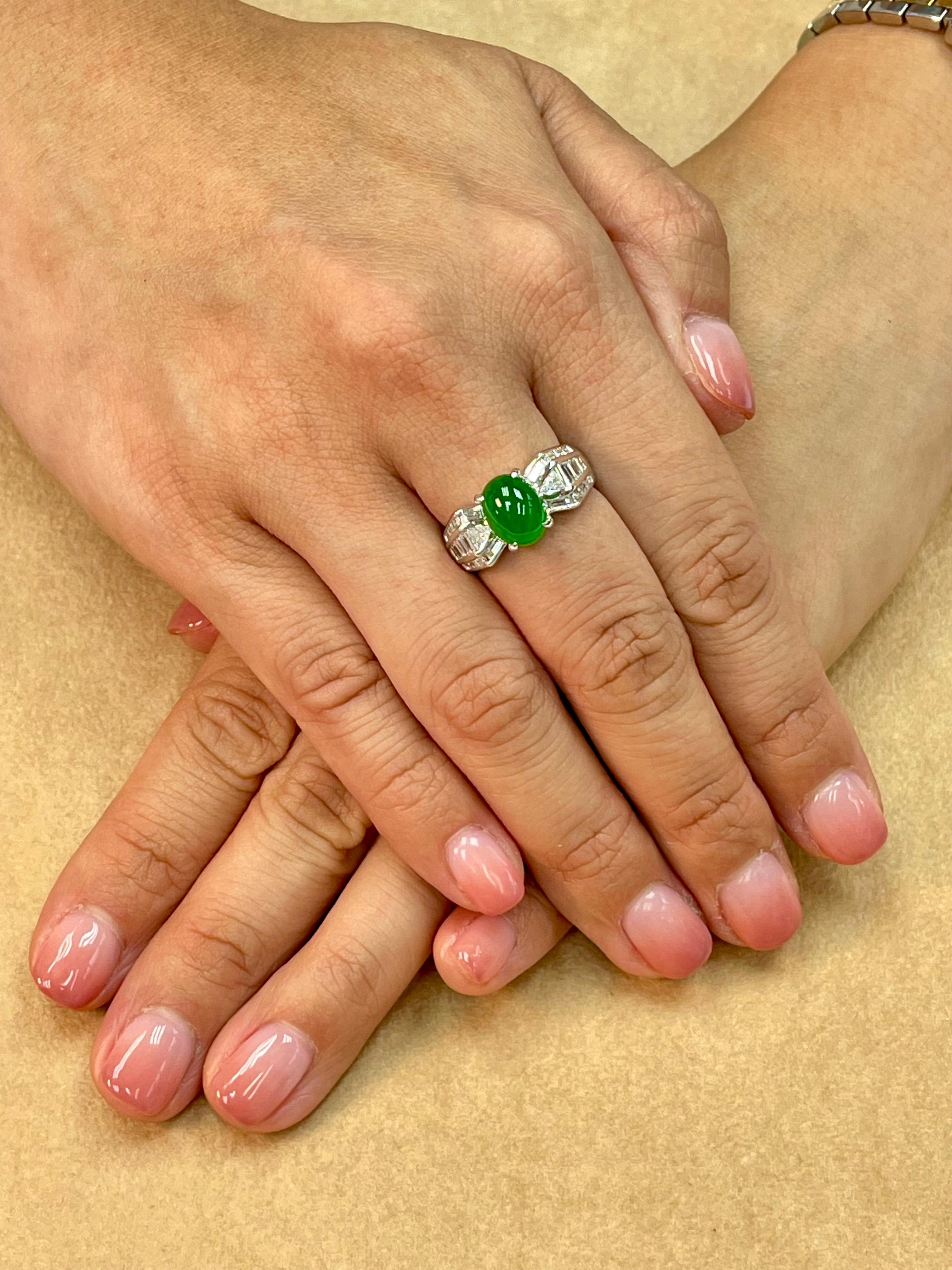 Please check out the HD video. Here is a bright apple green oval high domed cabochon jade and diamond ring. This jade is one step away from being a true imperial jade! It is certified as natural jadeite jade with no treatment or enhancement. The