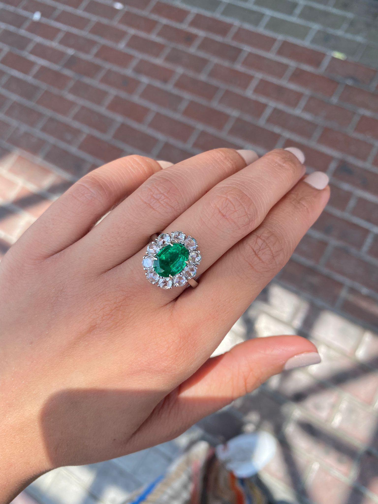 A beautiful 3.12 carat Zambian Emerald surrounded by 1.87 carat VS quality rose-cut White Diamond, all set in 18K White Gold. The quality of Zambian Emerald is of top quality, vivid green color with very few inclusions and has great luster and
