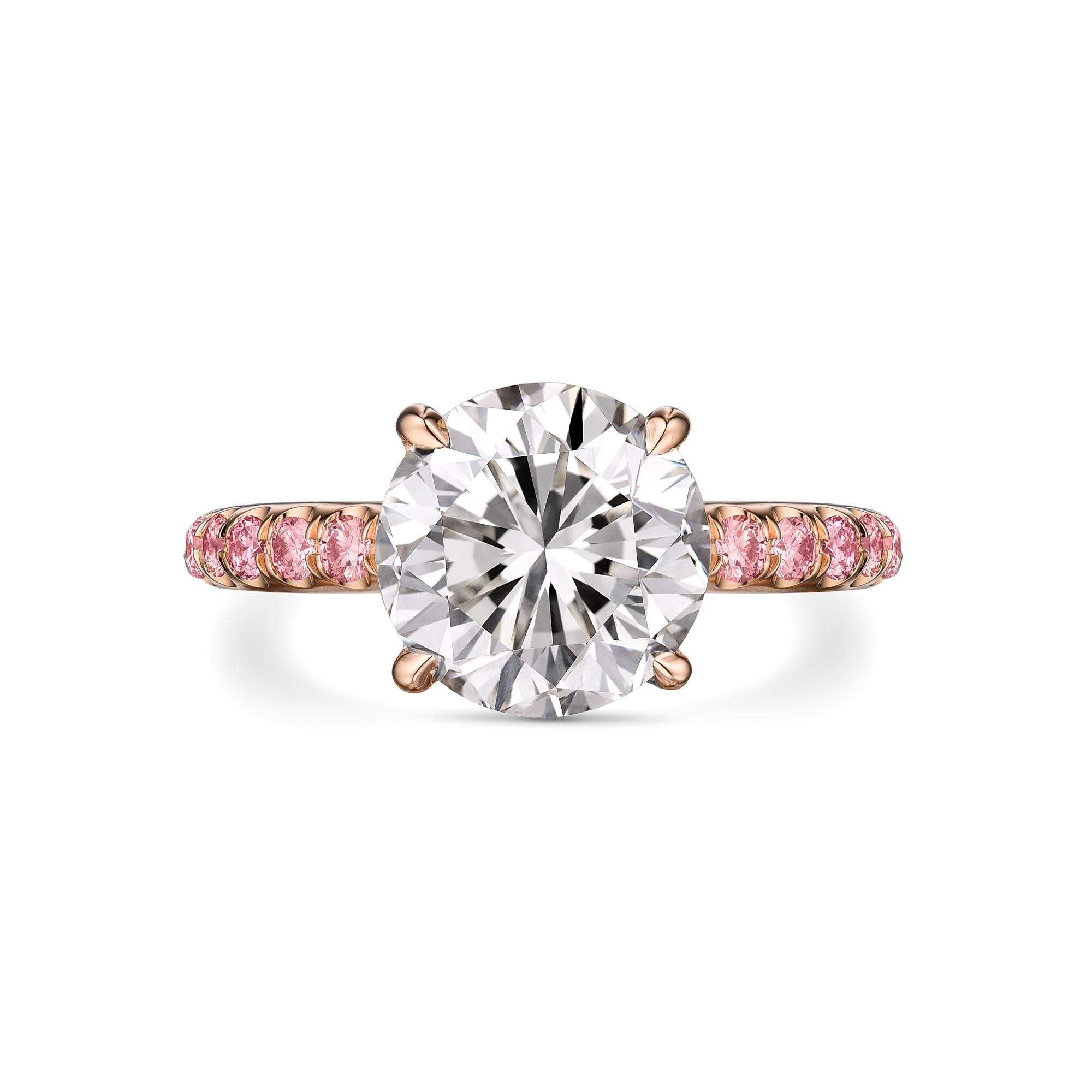 Diamond platinum ring with GIA certificate, no. 2223385118. Center stone: 3.01ct / L color, VS2 Brilliant Round cut diamond. Measurements: 8.82 x 8.84 x 5.90 mm. Side stones: .50ct / Fancy Pink Brilliant round. Metal: 14K Rose gold. Ring Weight: 3.8