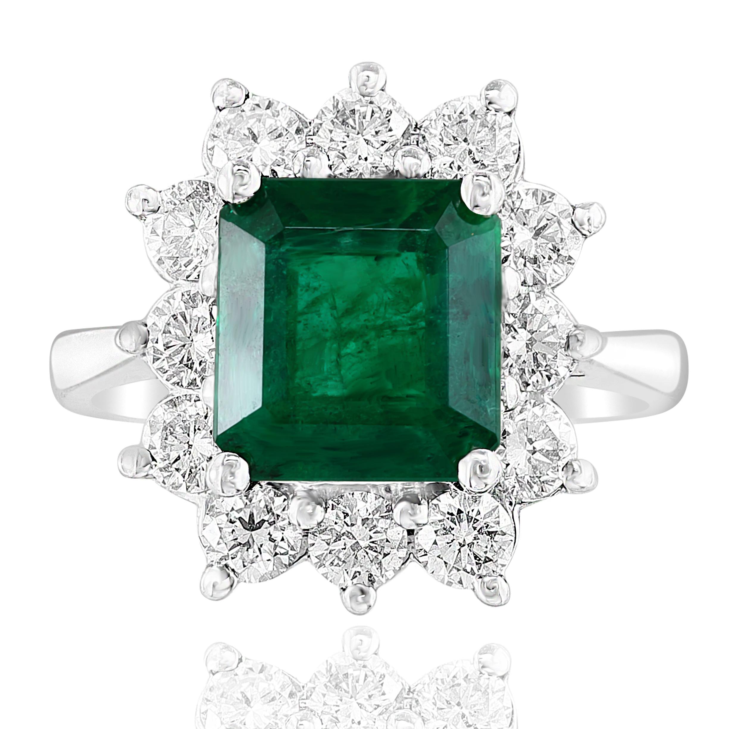 A stunning well-crafted engagement ring showcasing a 3.17-carat certified emerald-cut vivid green emerald. Flanking the center diamond are perfectly matched brilliant cut 12 diamonds weighing 1.20 carat in total, set in a polished 14K White Gold
