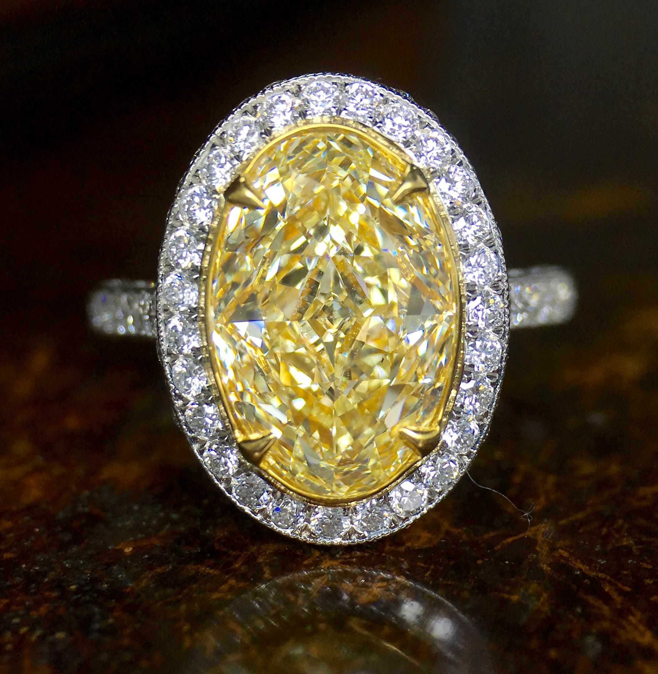 Contemporary Certified 3.17 Carat Fancy Yellow Oval Diamond Engagement Ring in Platinum