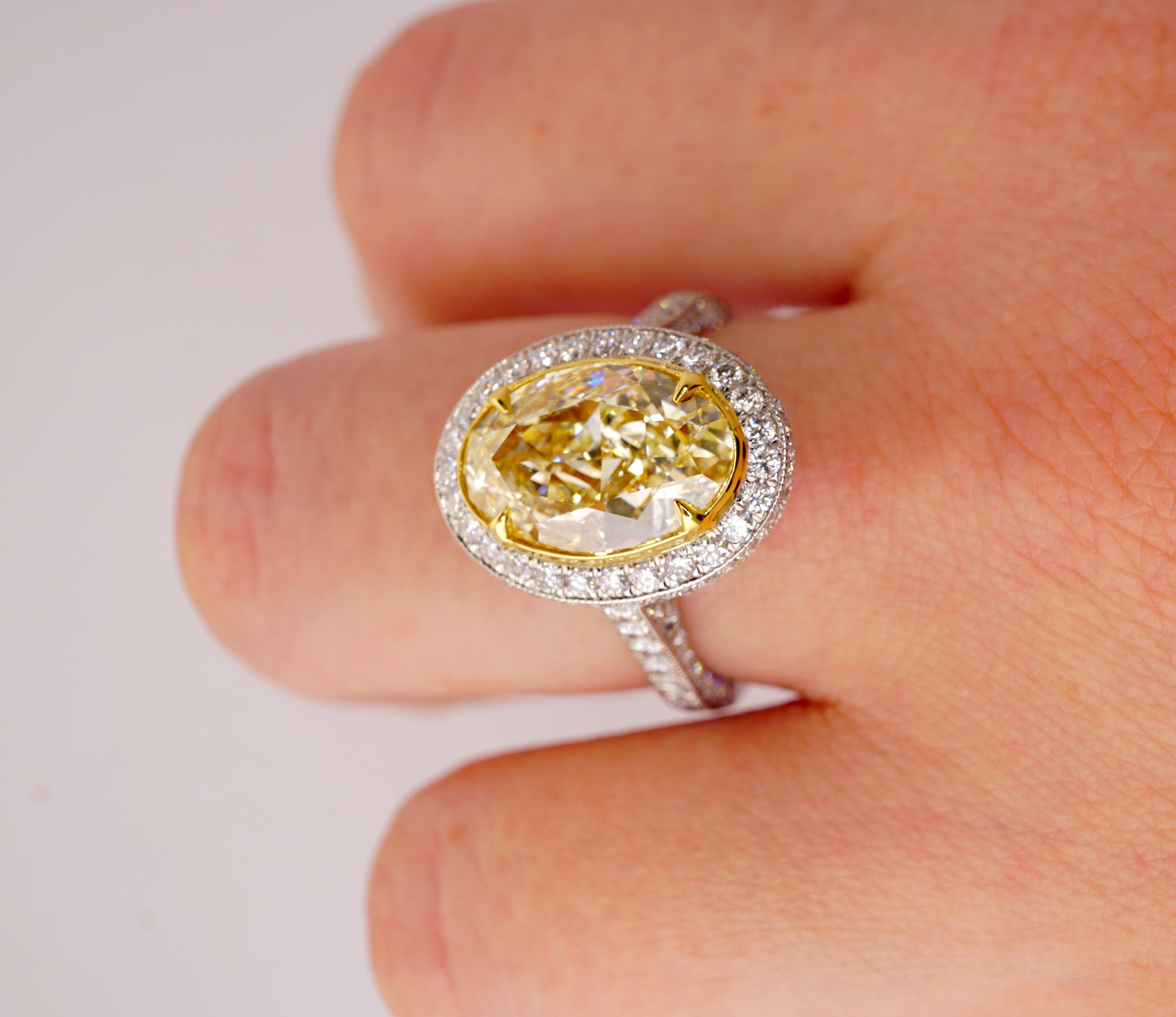 Certified 3.17 Carat Fancy Yellow Oval Diamond Engagement Ring in Platinum In New Condition In New York, NY