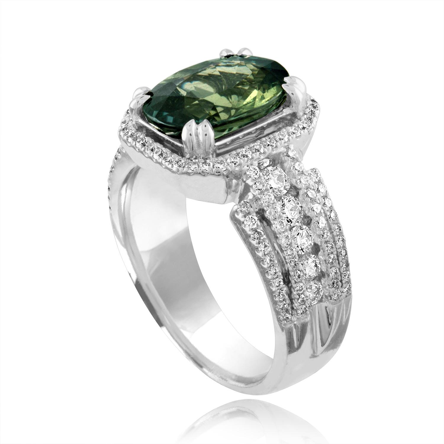 Stunningly Beautiful Bluish Yellow (Green) Sapphire Ring
The ring is 18K White Gold
The center stone is a Oval Green Sapphire 3.29 Carats
The stone is Certified by LAPIS, NO HEAT
There are 0.71 Carats in White Diamonds F/G VS/SI
The ring is a size