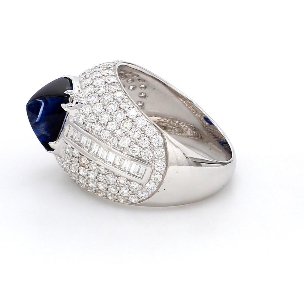 A Beautiful Handcrafted Ring in 18 karat White Gold  with Natural No Heat IGI Certified Blue Sapphire in Sugar loaf Cabochon of Madagascar origin and Brilliant Cut Colorless Diamonds.

Blue Sapphire Details
Weight: 3.29 carats
Accompanied by IGI