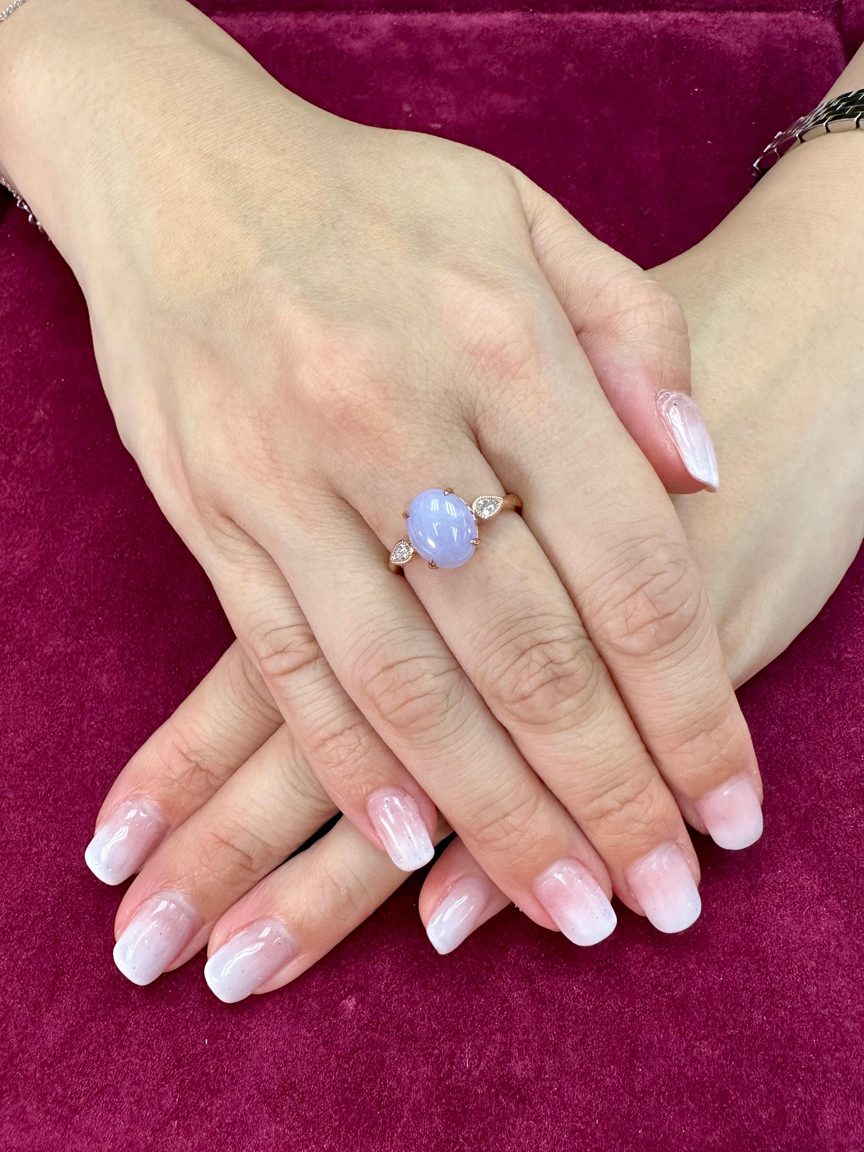 Please check out the HD Video! Here is a very eye pleasing lavender jade and diamond 3 stone ring! It is certified natural jadeite jade. The ring is set in 18k rose gold and diamonds. There are 2 pear shaped diamonds that are on each side of the