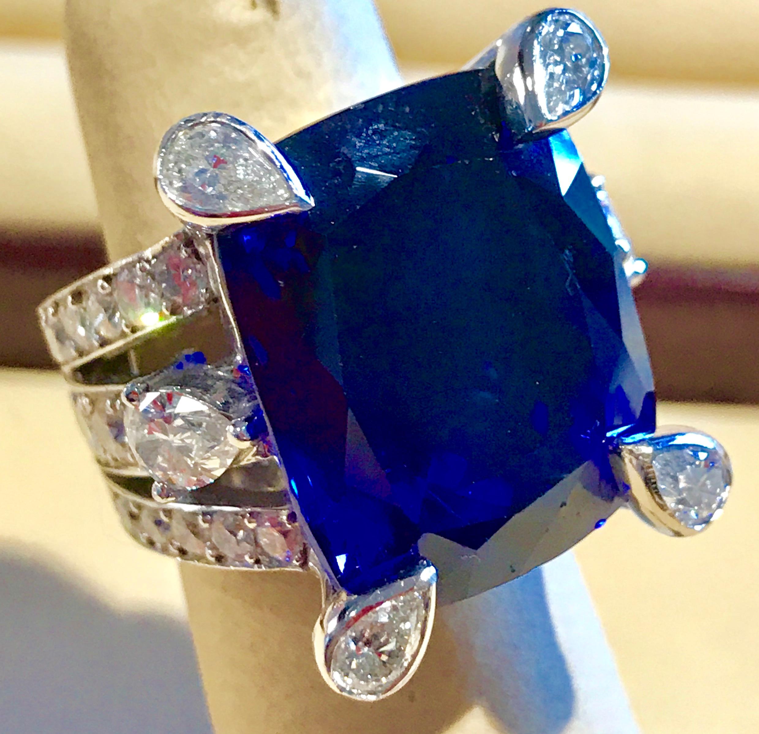 AGL Certified Natural 35.12 Carat Cushion-Cut Tanzanite Ring  4.5 Carat Diamonds
18 Karat white gold 26 gm
This extraordinary, 35.12 carat tanzanite is truly an extraordinary gemstone. There are  total  of 4.5 carats of shimmering white diamonds,
