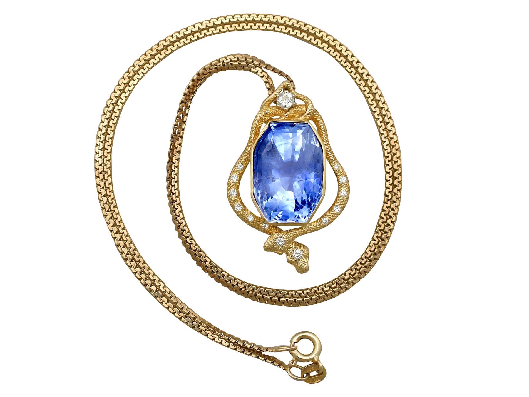 A magnificent 36.50 carat Ceylon sapphire and 0.32 carat diamond, 18 karat yellow gold and 18 karat white gold set 'serpent' pendant; part of our diverse vintage jewelry collections.

This magnificent vintage 1950s Ceylon sapphire pendant has been