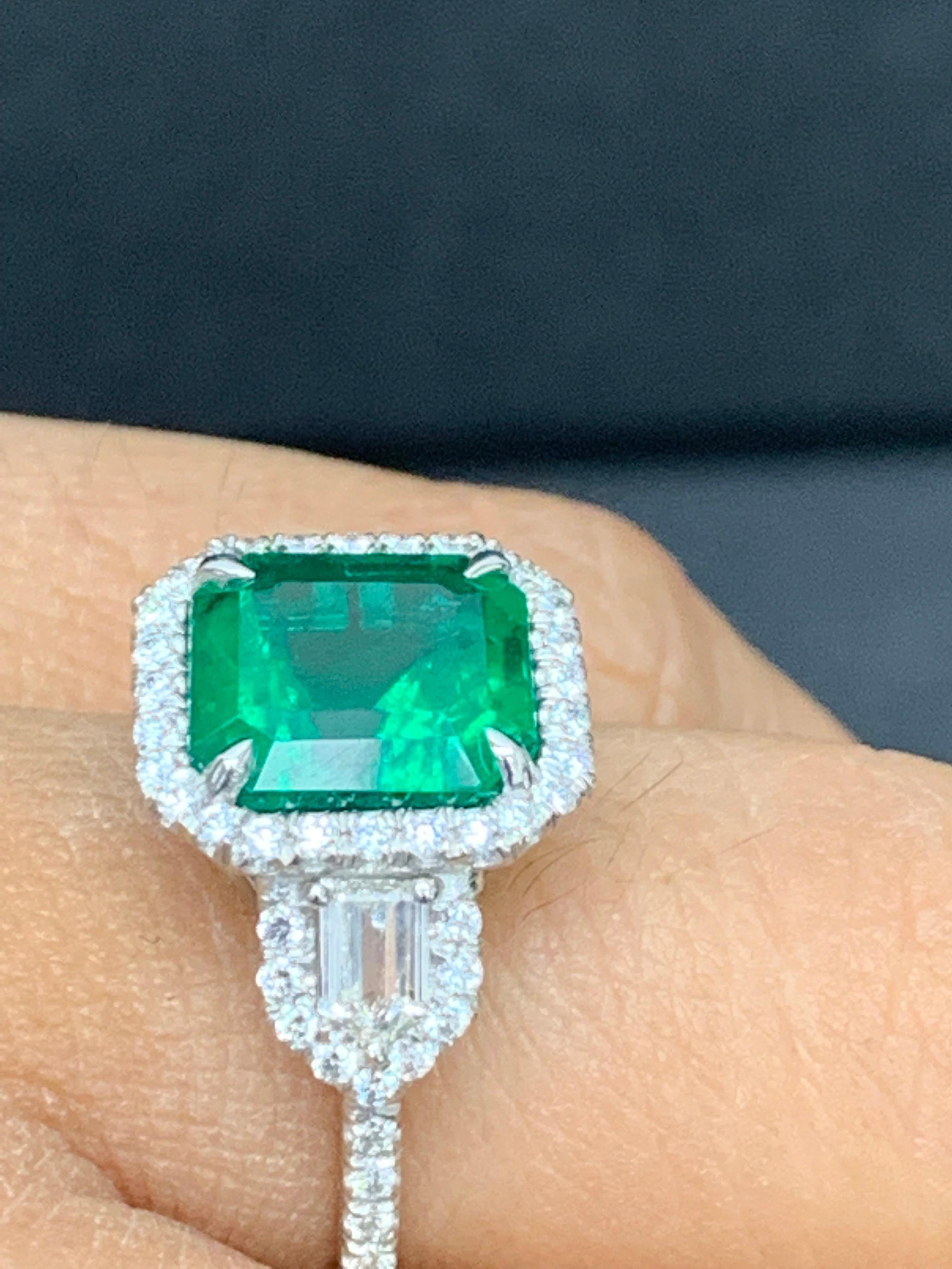 Emerald Cut Certified 3.69 Carat Emerald and Diamond Three Stone Engagement ring in platinum For Sale