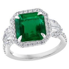 Certified 3.69 Carat Emerald and Diamond Three Stone Engagement ring in platinum