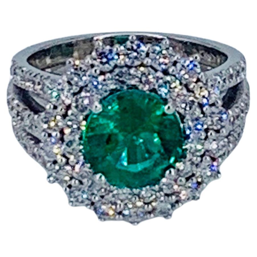 This beautiful Colombian Emerald and Diamond Halo cocktail ring is truly gorgeous. Nestled amongst multiple Diamonds the Emerald is placed in the centre. 

The bright white natural Diamonds compliment the precious jewel and add extra beauty to the
