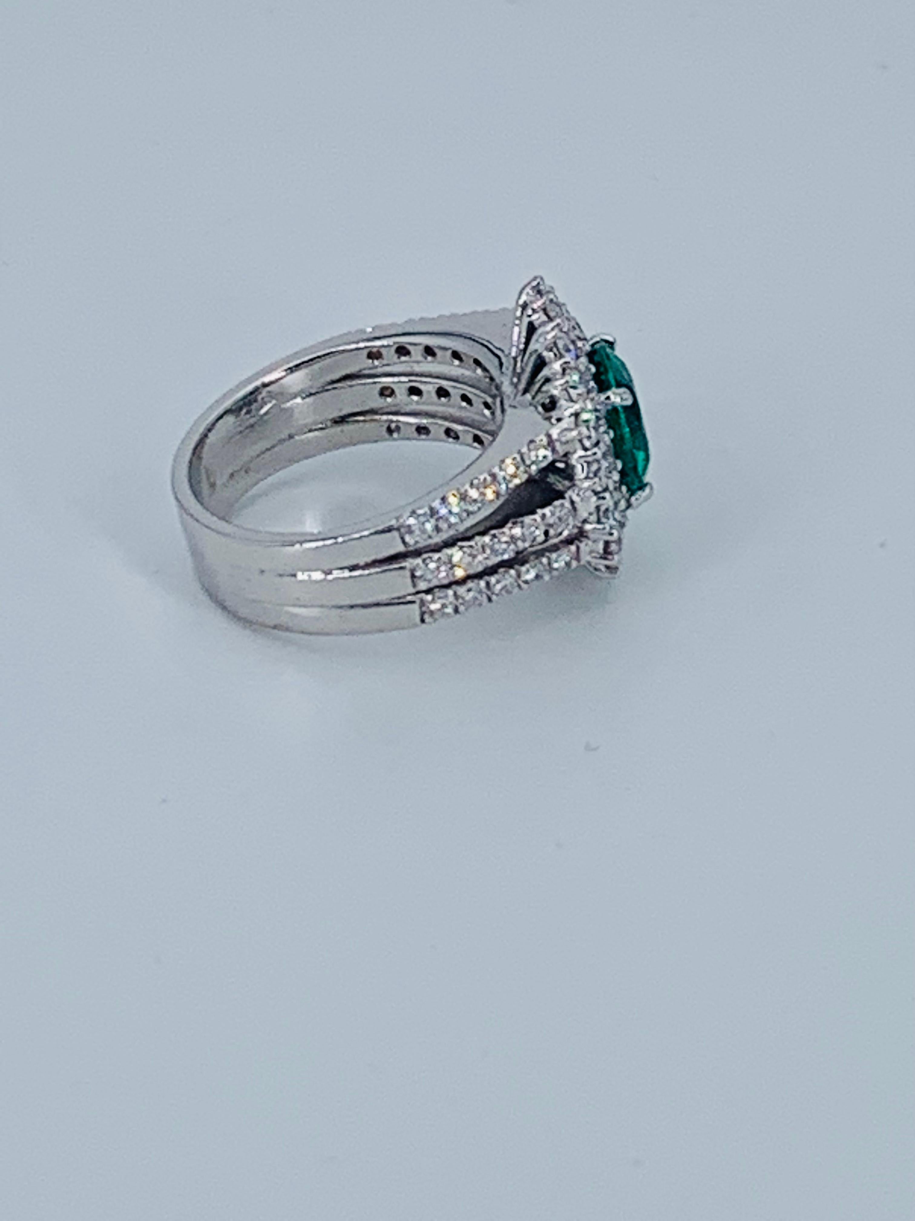 Round Cut Contemporary 3.82 Carat Colombian Emerald Halo Diamond Cocktail Ring For Sale