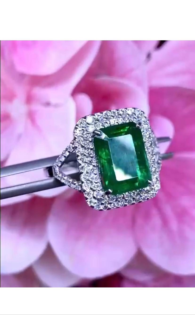 Amazing ring in modern design , in 18k gold with a  Natural Zambian  Emerald  of 3,90 carats , and round brilliant cut of 0,75 carats F/VS.
Handcrafted by artisan goldsmith.
Excellent manufacture and quality.
Complete with AIG report.
Whosale
