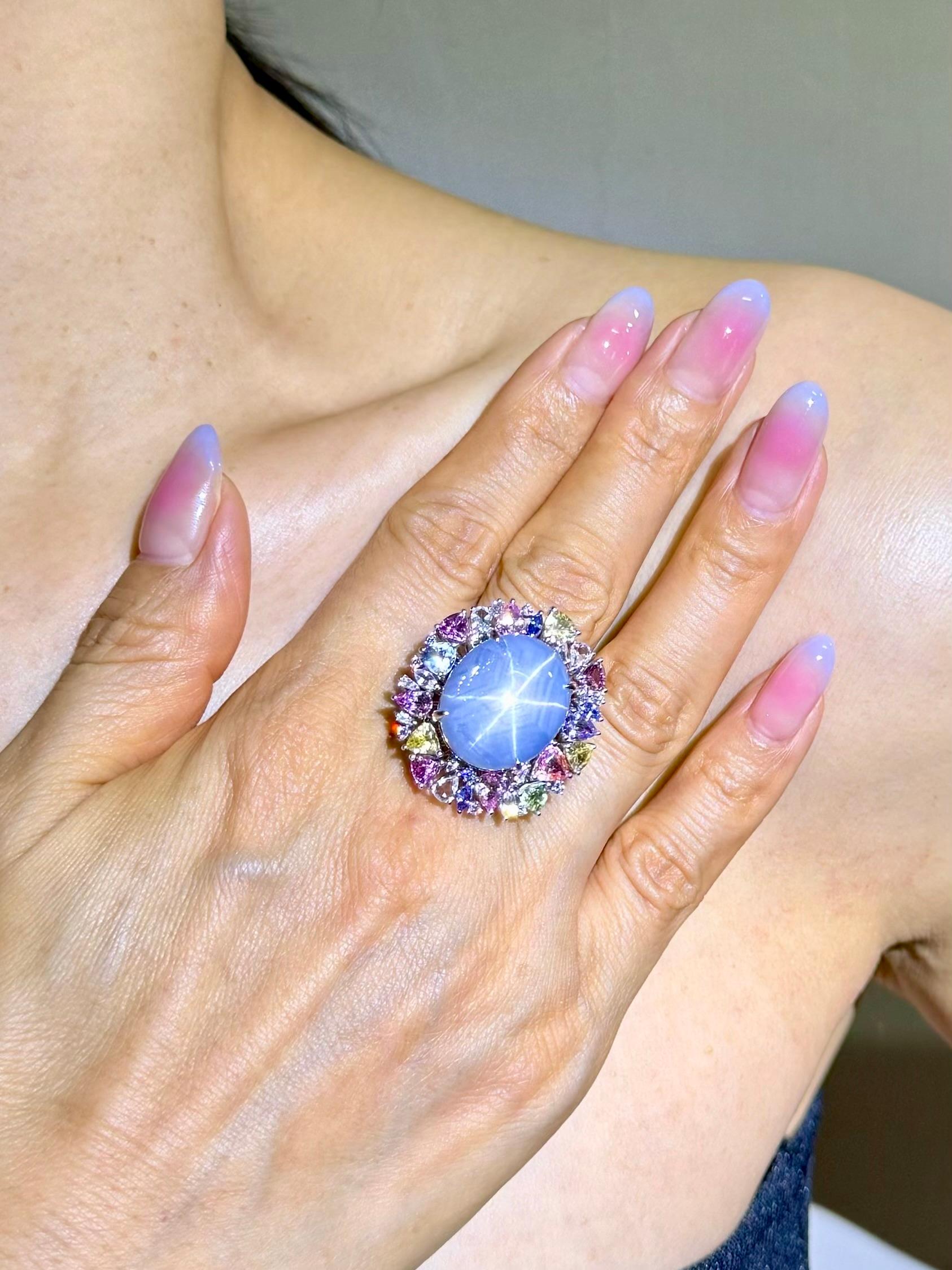 Please check out the HD Video. The color combination is out of this world! Here is a superb oversized natural star Sapphire and diamond ring and pendant (two use). The ring is set in 18k white gold, diamonds and fancy shaped color sapphires. There