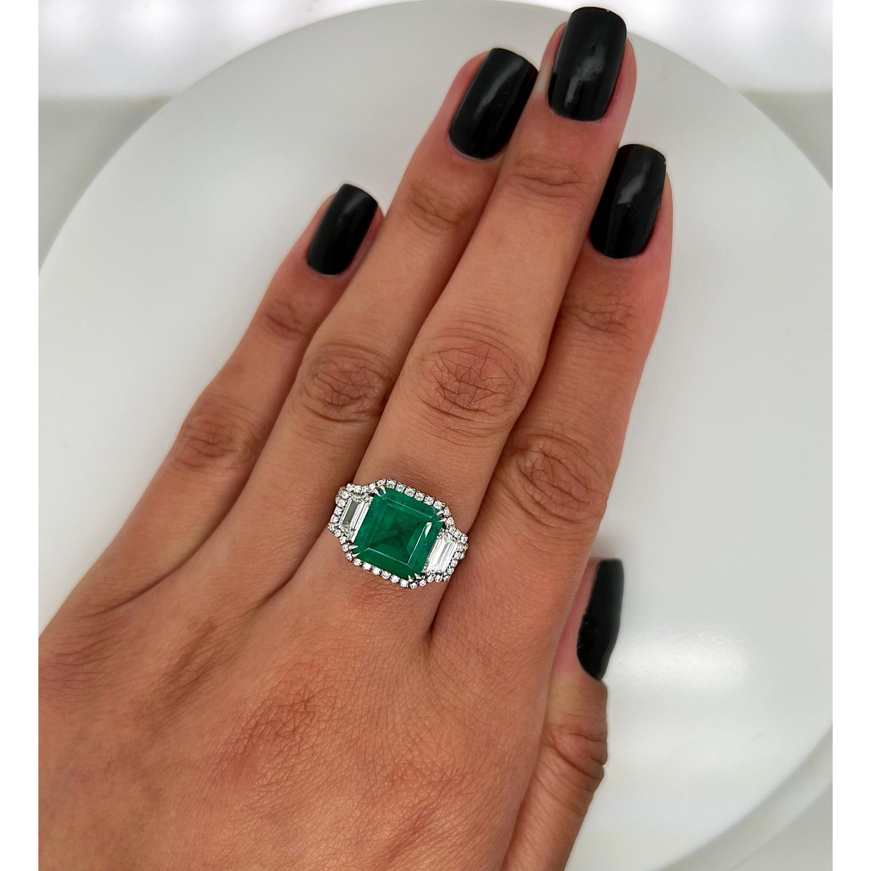 Certified 3.91 Carat Natural Emerald Diamond Cocktail Ring Unique Diamond Ring

A stunning ring featuring IGI/GIA Certified 3.91 Carat Natural Emerald and 0.55 Carat of Diamond Accents set in 18K Solid Gold.

Emeralds are highly valued for their