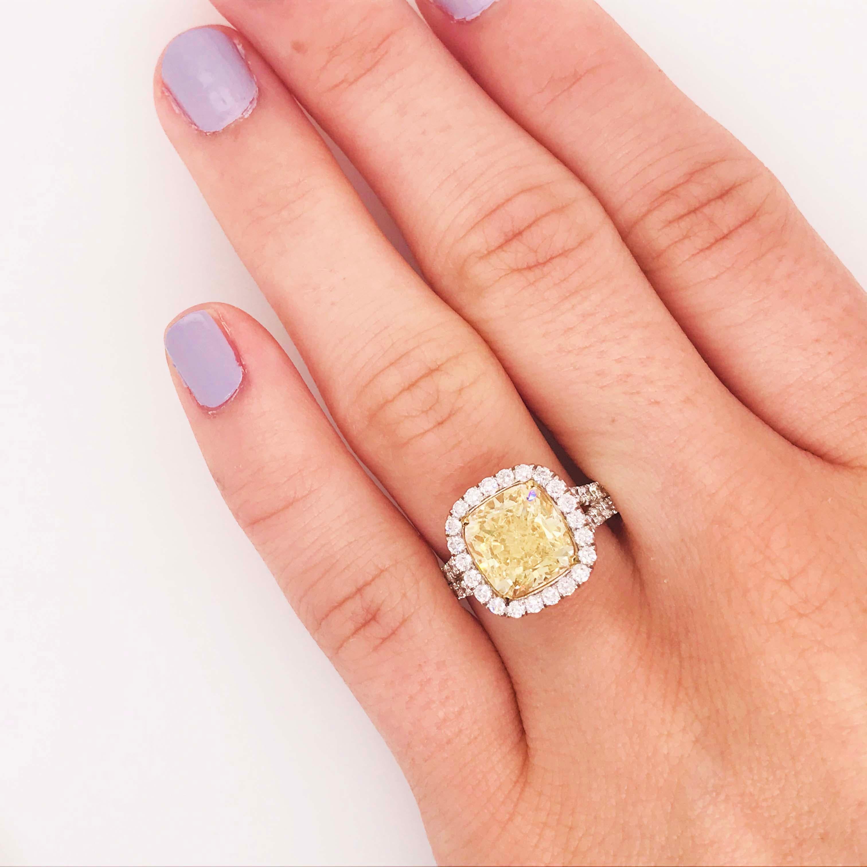 Fancy Yellow Diamond Ring has a gorgeous 4.00-carat yellow diamond set in an incredible 18 karat white gold semi-mount that has the yellow diamond set in 18 karat yellow gold prongs.
This incredible fancy yellow diamond ring is breathtaking! With a